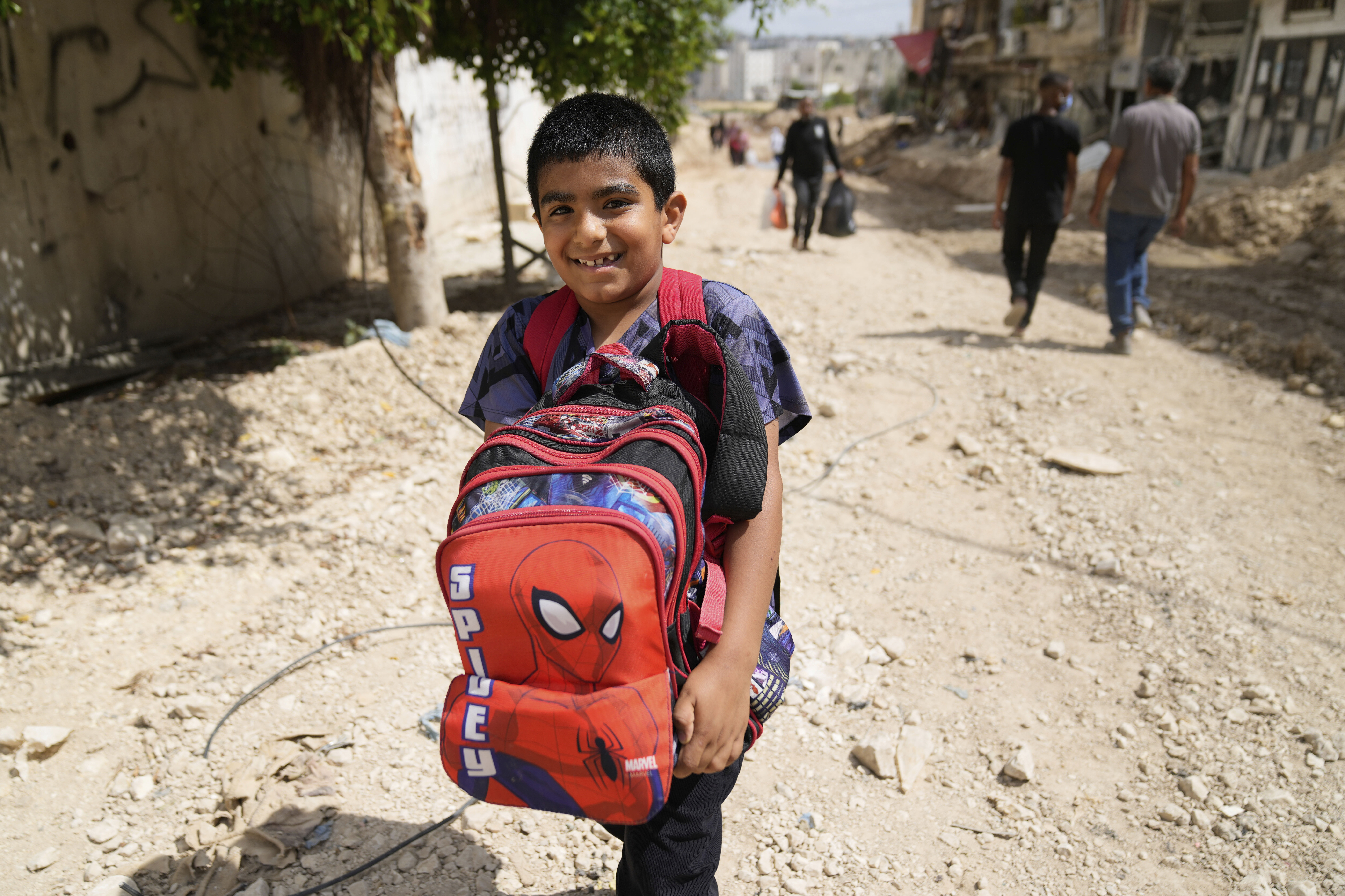 Residents of the now evacuated refugee camp of Tulkarem return to collect belongings before the destruction of their homes as Israeli forces prepare to carry out the demolition of 116 homes across the two refugee camps of the Israeli occupied West Bank city of Tulkarem, Friday, May 2, 2025. (AP Photo/Nasser Nasser)