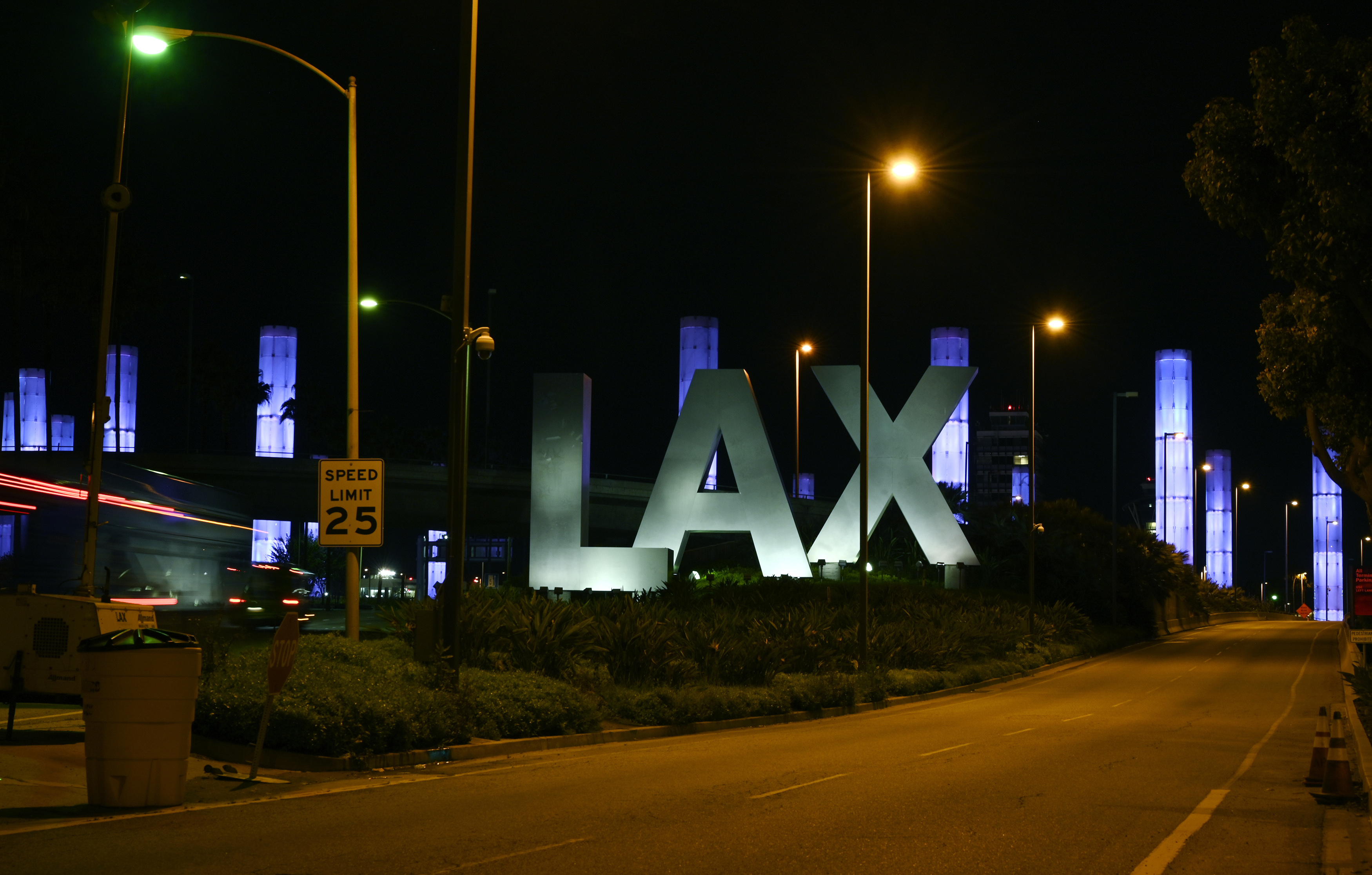 FILE - The LAX Gateway Kinetic Light Pylons are seen lit up in blue near Los Angeles International Airport, Friday, April 10, 2020, in Los Angeles. (AP Photo/Mark J. Terrill, File)