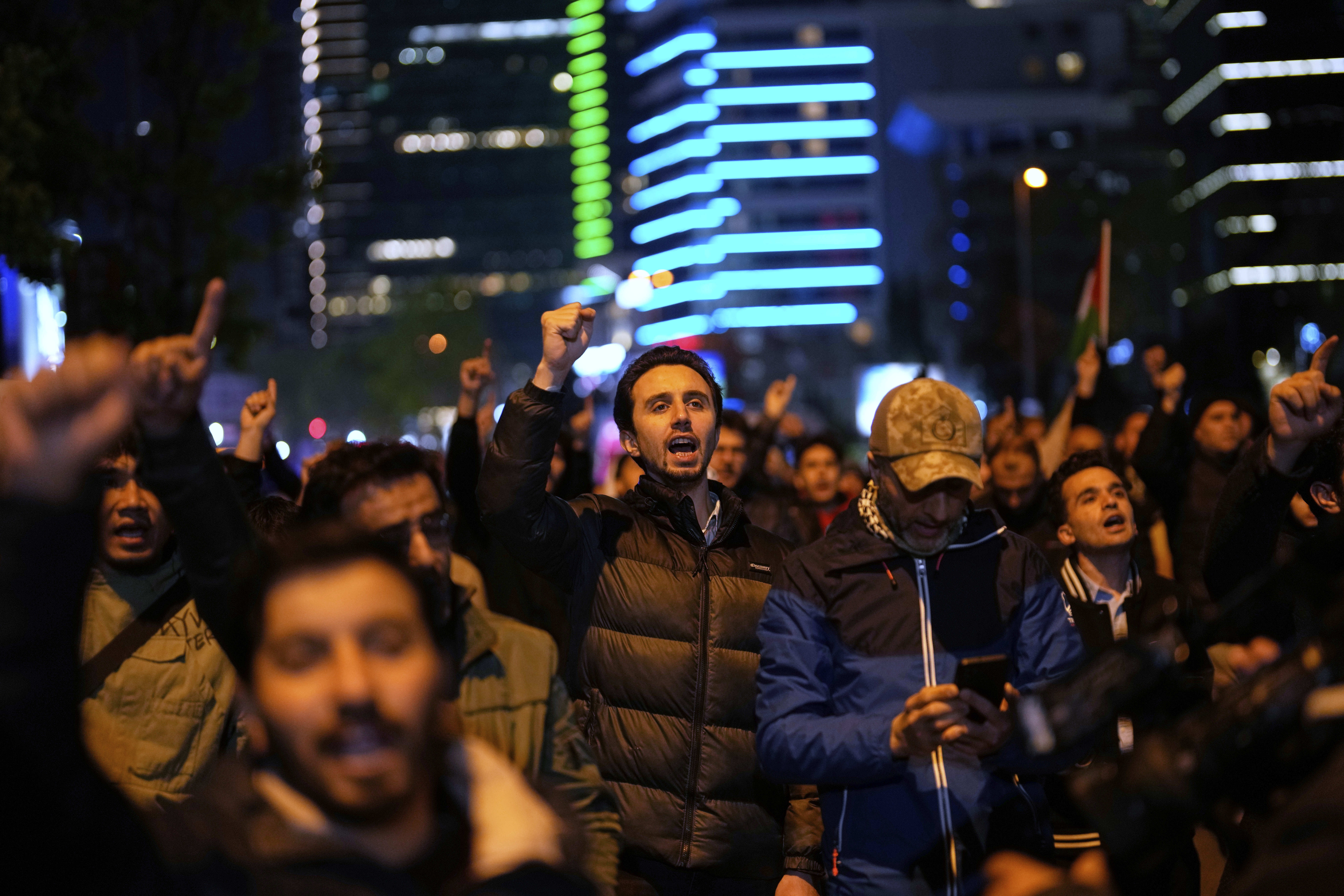 People protest against an Israeli drone attack on a vessel carrying aid to Gaza in international waters off Malta, outside the Israeli consulate in Istanbul, Friday, May 2, 2025. (AP Photo/Khalil Hamra)