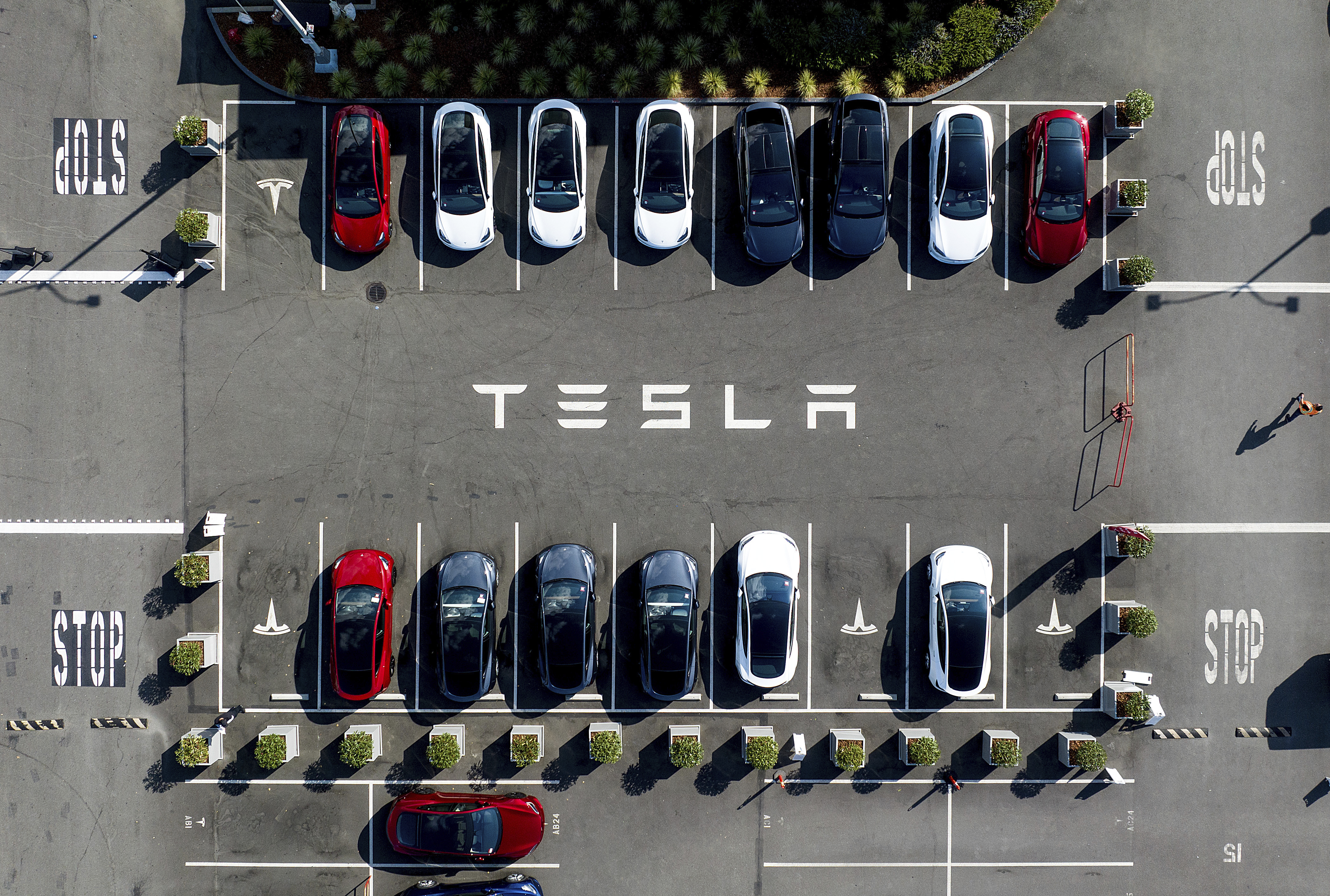FILE - Tesla vehicles line a parking lot at the company's Fremont, Calif., factory on Sept. 18, 2023. (AP Photo/Noah Berger, file)
