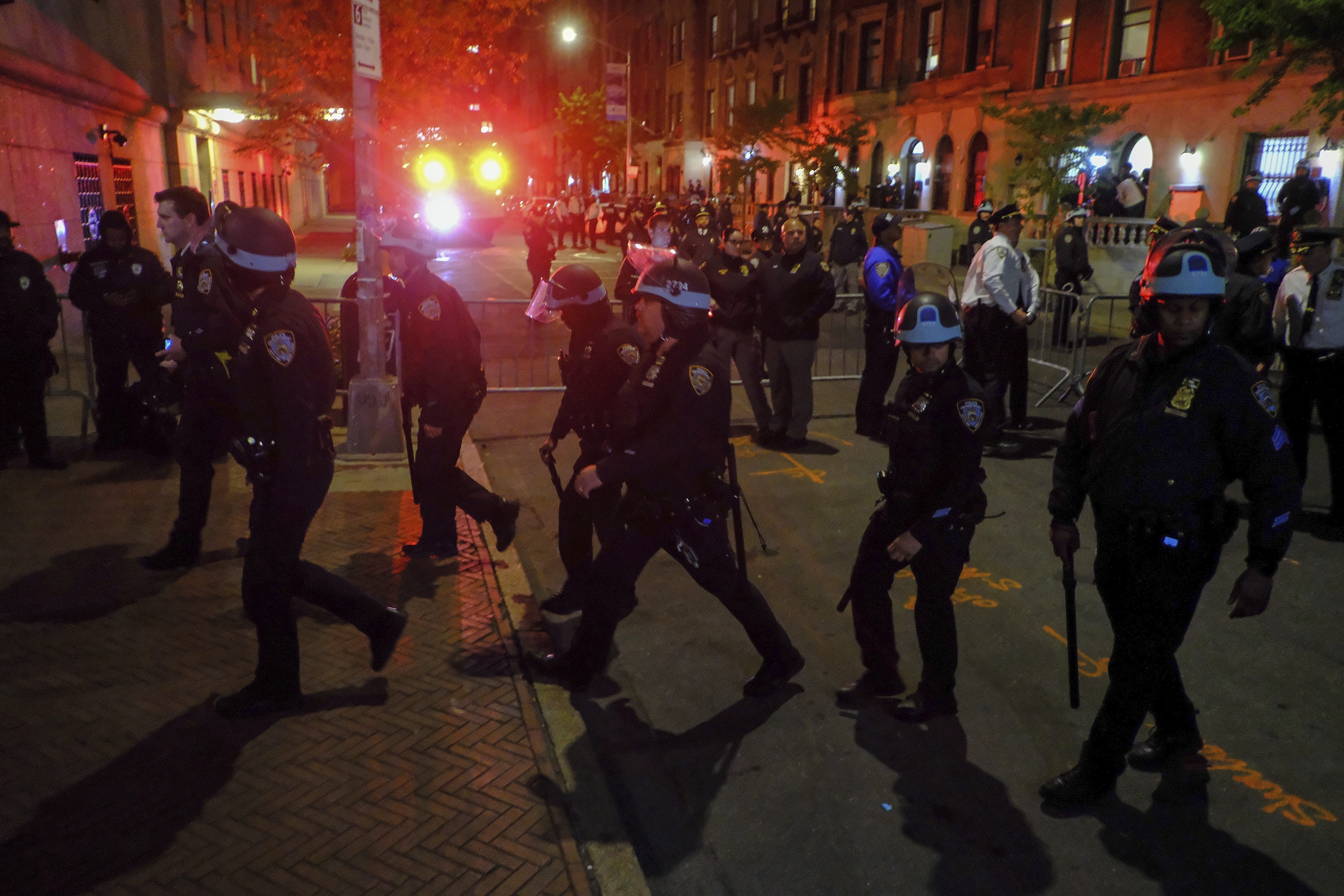 FILE - Members of the New York Police Department strategic response team move towards an entrance to Columbia University, Tuesday, April 30, 2024, in New York. (AP Photo/Julius Motal, File)
