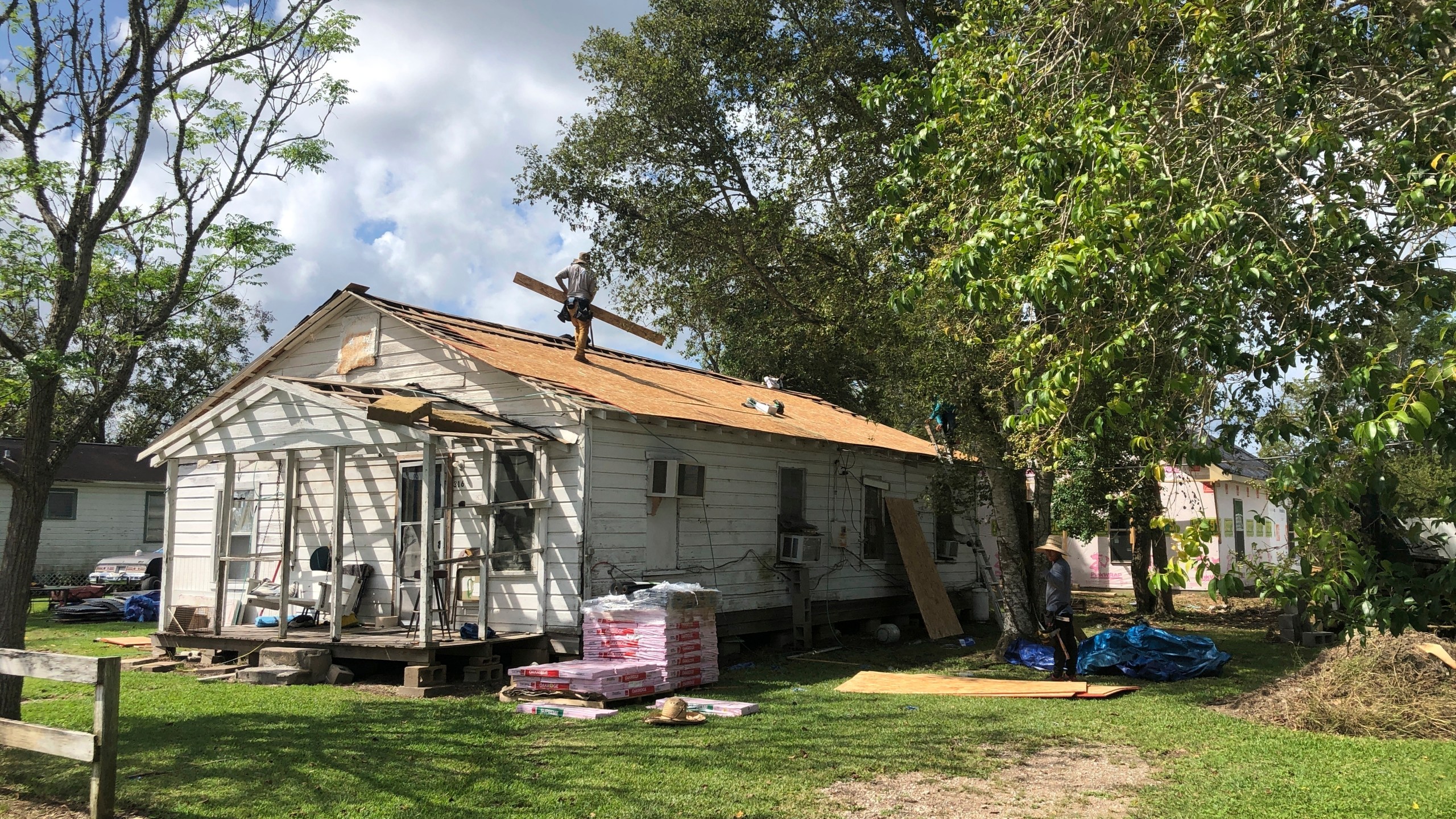 A storm-damaged roof was repaired in 2021 by Mosaic in Action, a nonprofit organization that relies on anow-suspended AmeriCorps program, is seen in West Columbia, Texas. (AP via Jim Liberatore)
