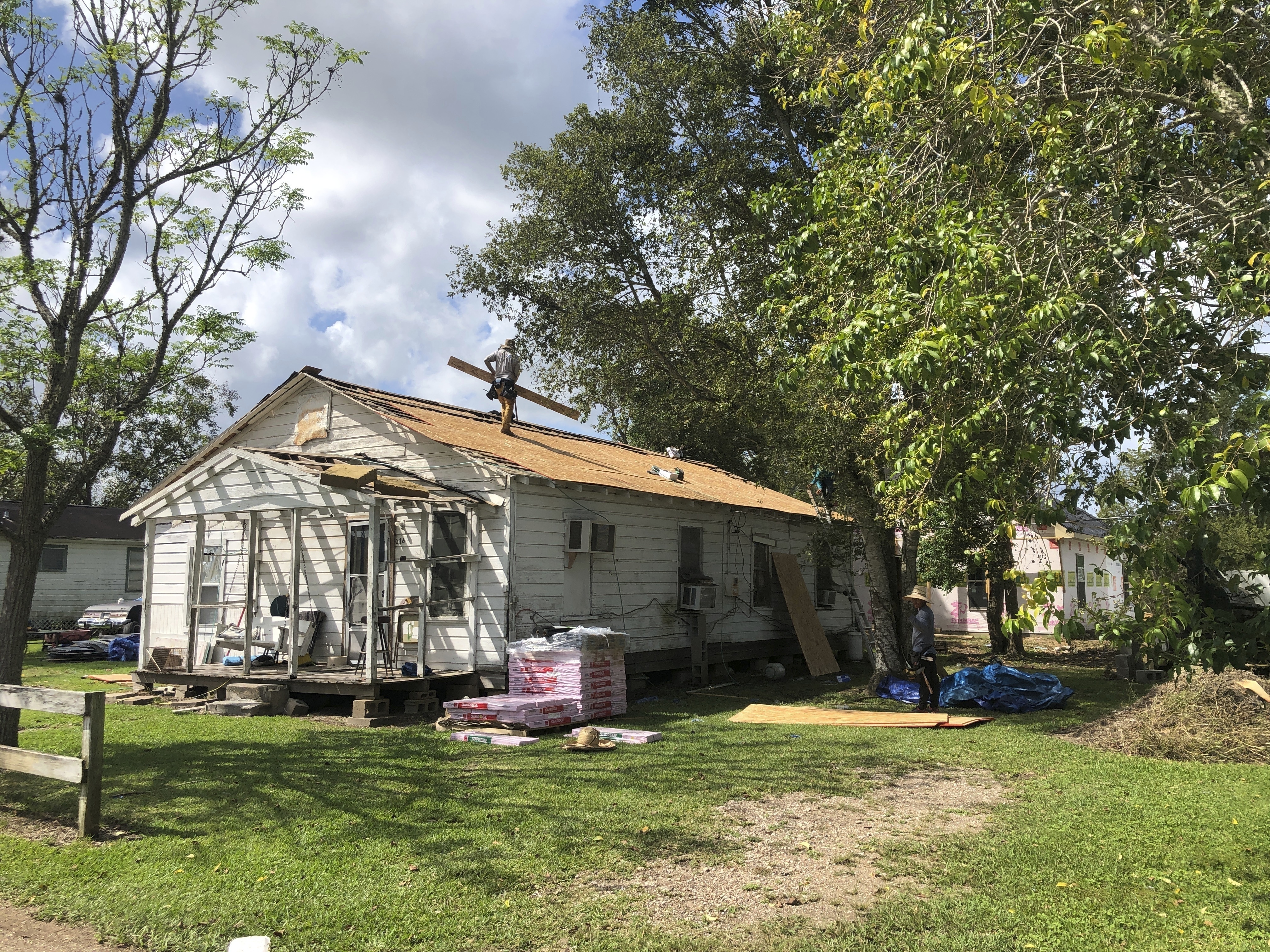 A storm-damaged roof was repaired in 2021 by Mosaic in Action, a nonprofit organization that relies on anow-suspended AmeriCorps program, is seen in West Columbia, Texas. (AP via Jim Liberatore)