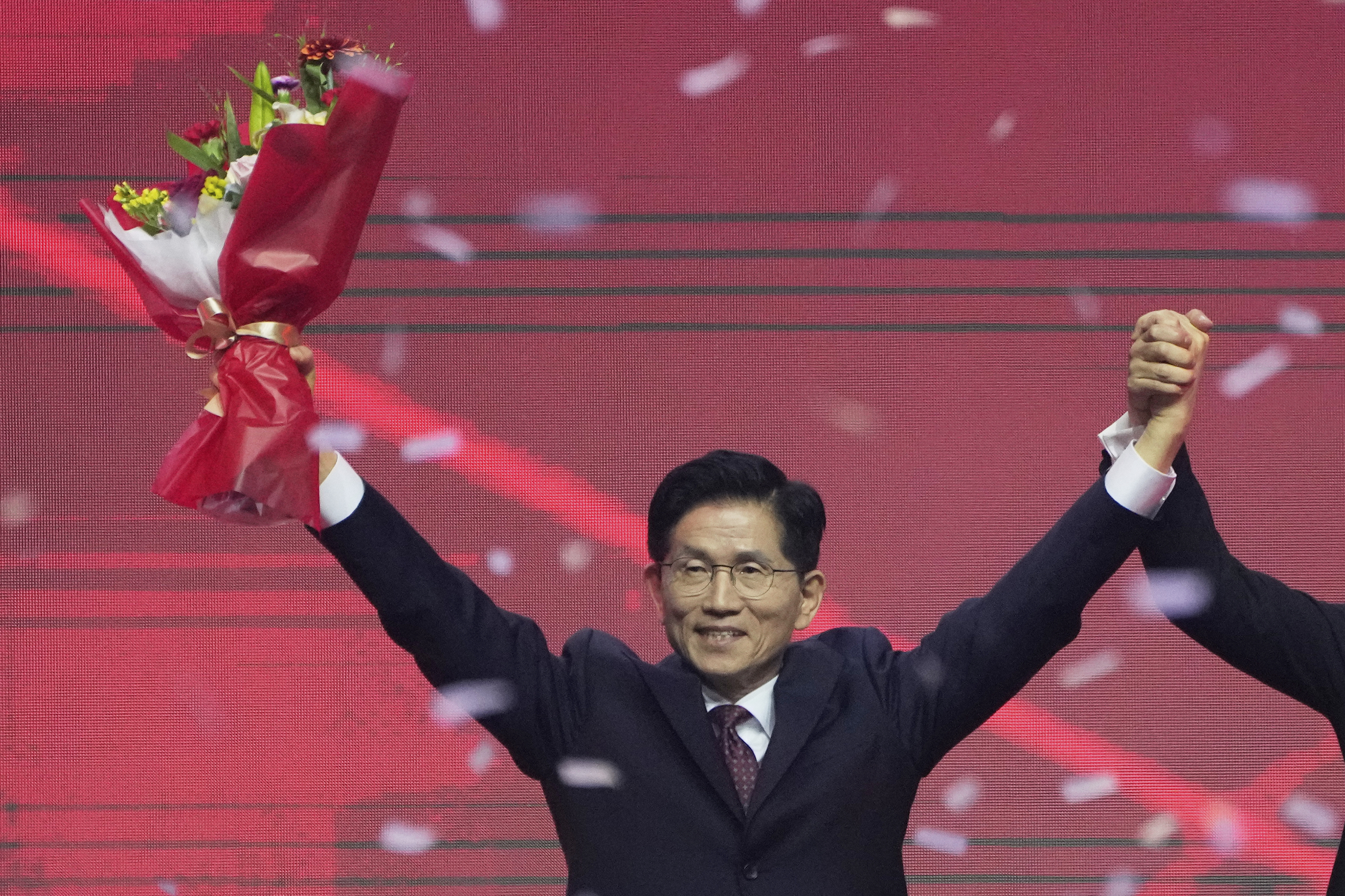 South Korea's former Labor Minister Kim Moon Soo celebrates after winning the nomination as the presidential election candidate during the People Power Party's convention in Goyang, South Korea, Saturday, May 3, 2025. (AP Photo/Ahn Young-joon)