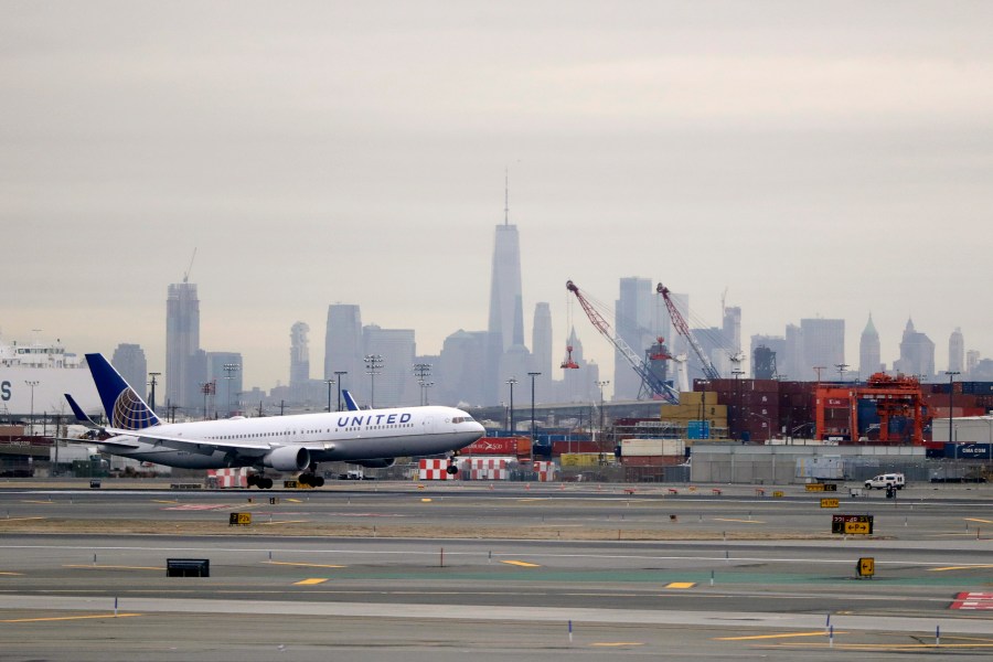 FILE - A United Airlines jet prepares touches down at Newark Liberty International Airport a day after a temporary grounding of aircraft was placed after reports of drones in the flight path, Wednesday, Jan. 23, 2019, in Newark, N.J. (AP Photo/Julio Cortez, File)