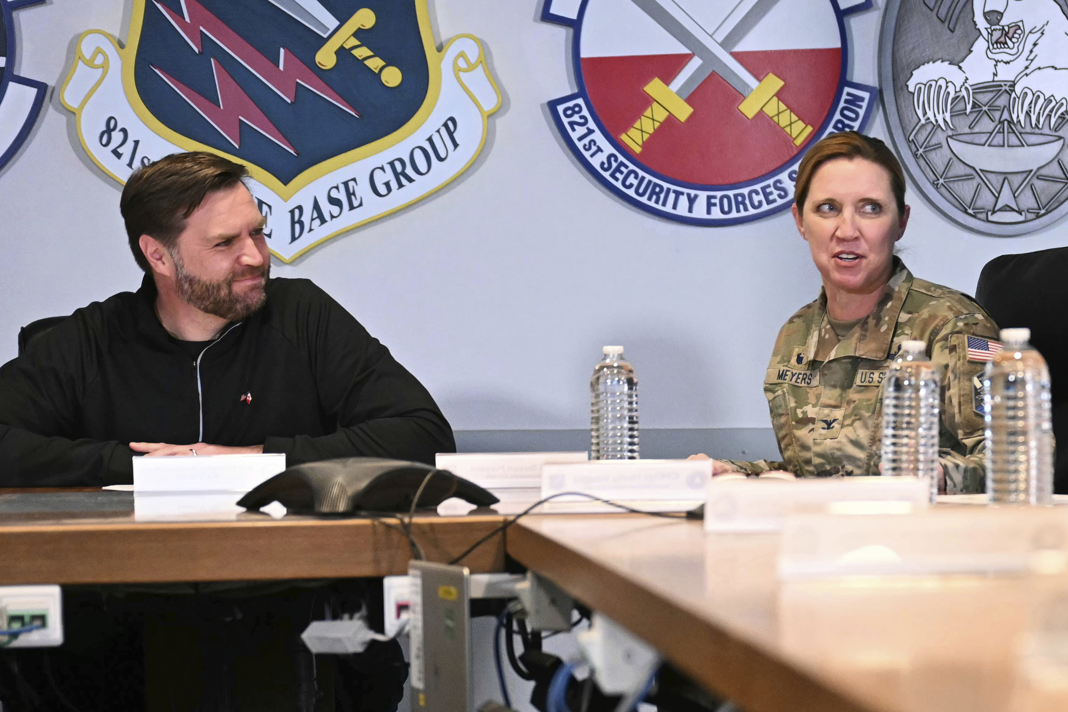 Vice President JD Vance, left, listens to Col. Susan Meyers, right, during a briefing at Pituffik Space Base in Greenland, Friday, March 28, 2025. (Jim Watson/Pool via AP)