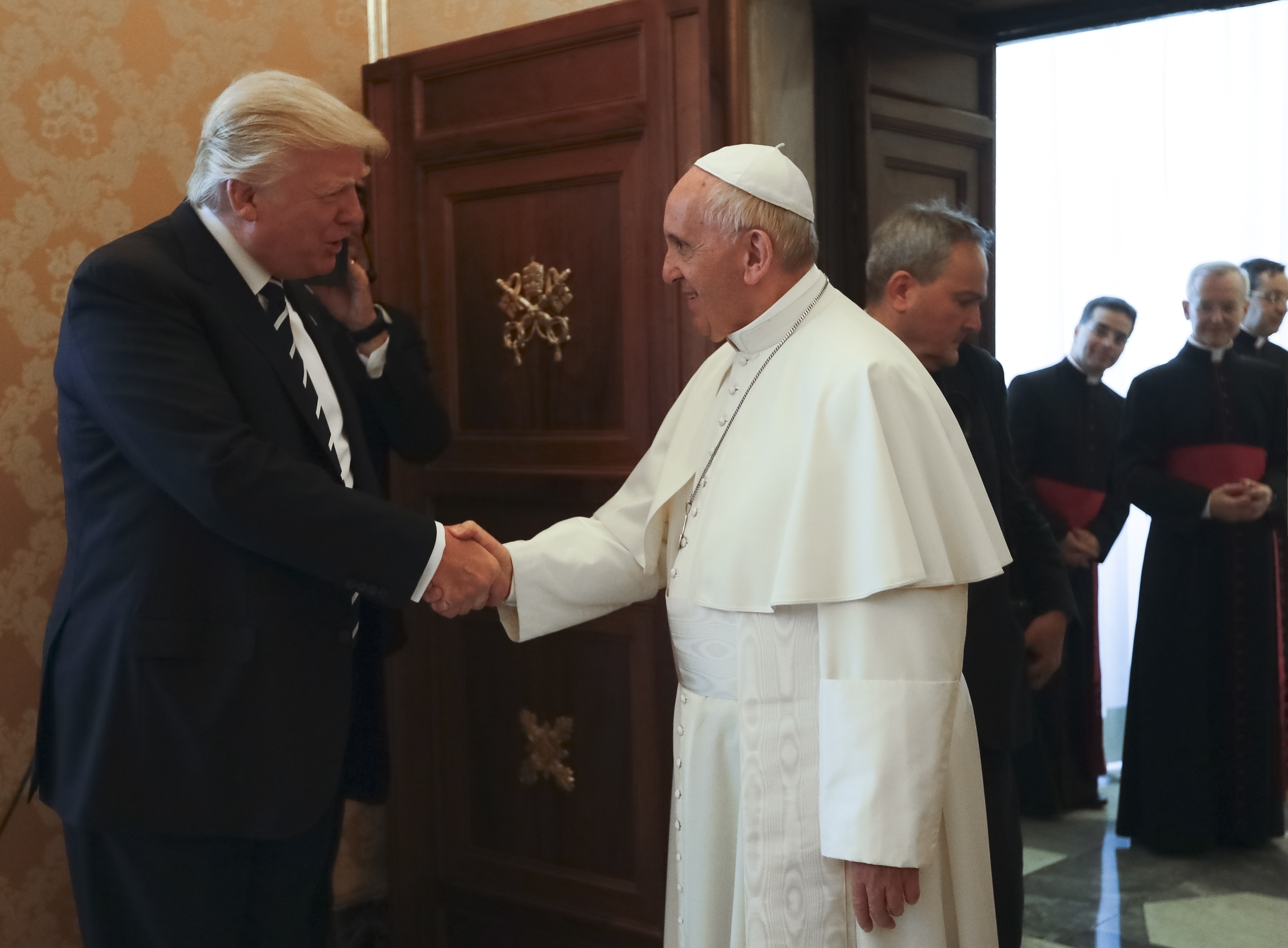 FILE - Pope Francis meets with President Donald Trump, left, on the occasion of their private audience, at the Vatican, May 24, 2017. (AP Photo/Alessandra Tarantino, Pool, File)
