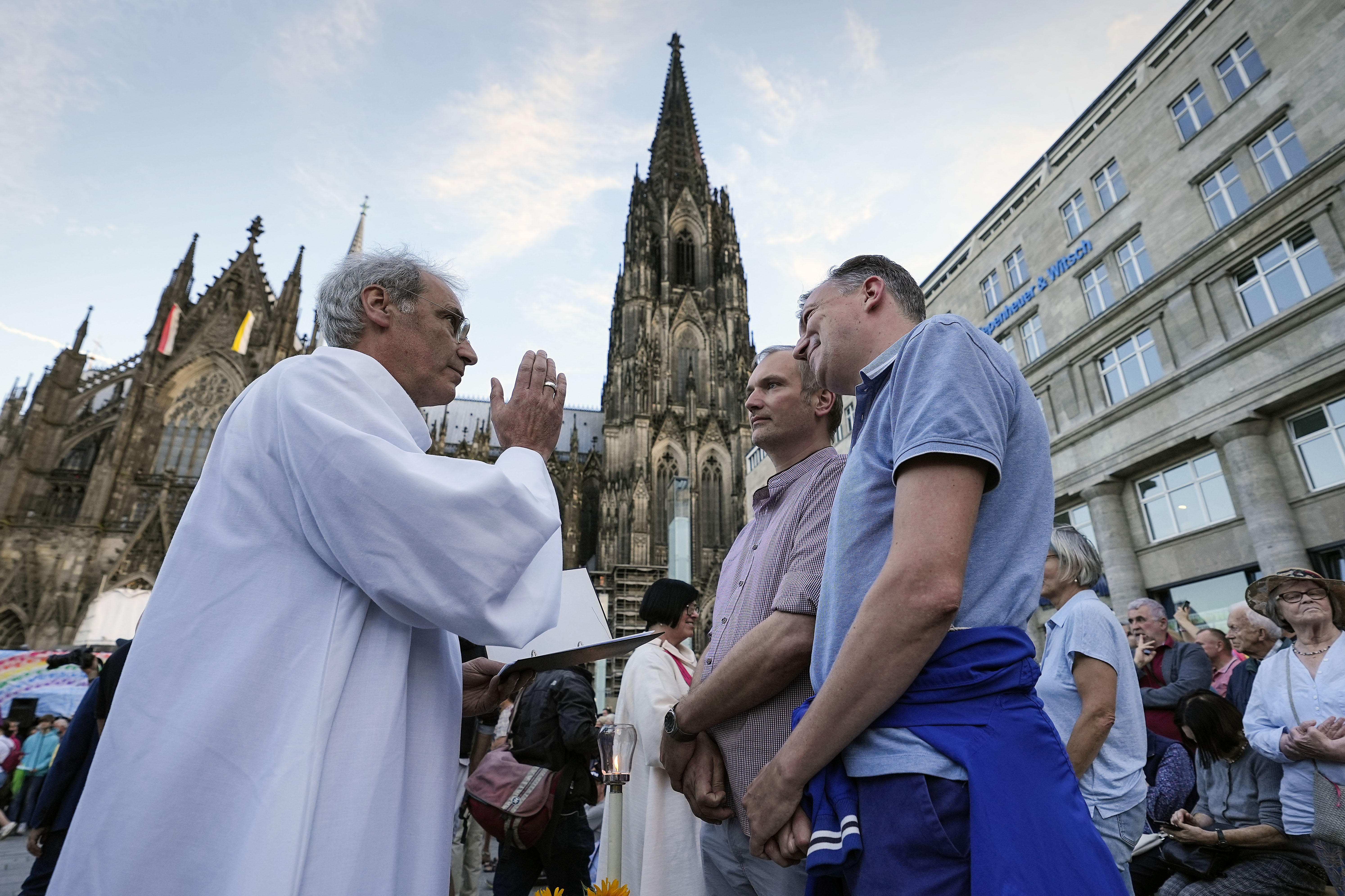 FILE - Same-sex couples take part in a public blessing ceremony in front of the Cologne Cathedral in Cologne, Germany, Sept. 20, 2023. (AP Photo/Martin Meissner, File)