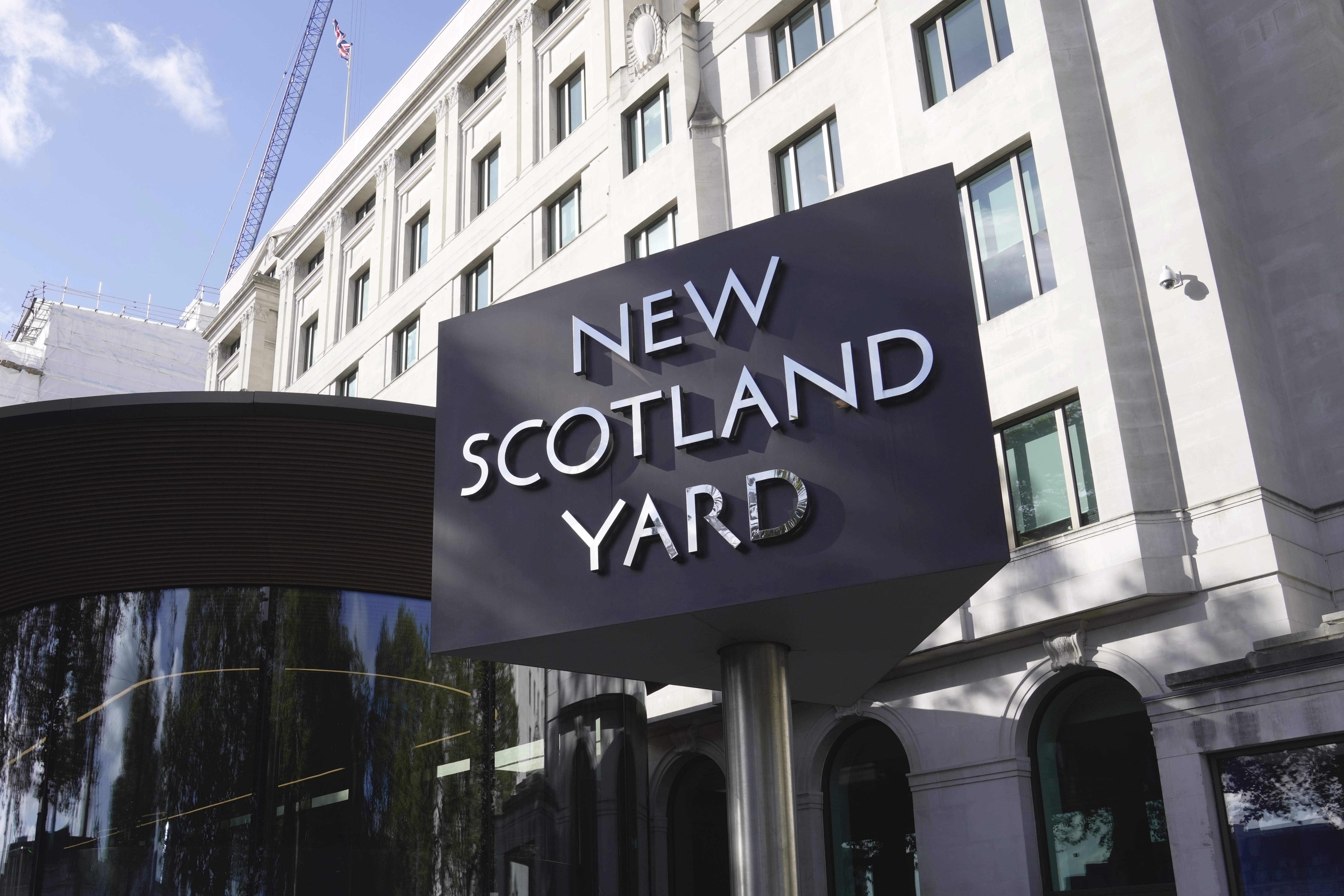FILE - A sign stands in front of the New Scotland Yard, the headquarters of the London Metropolitan Police, in London, Monday, Sept. 25, 2023. (AP Photo/Kin Cheung, File)