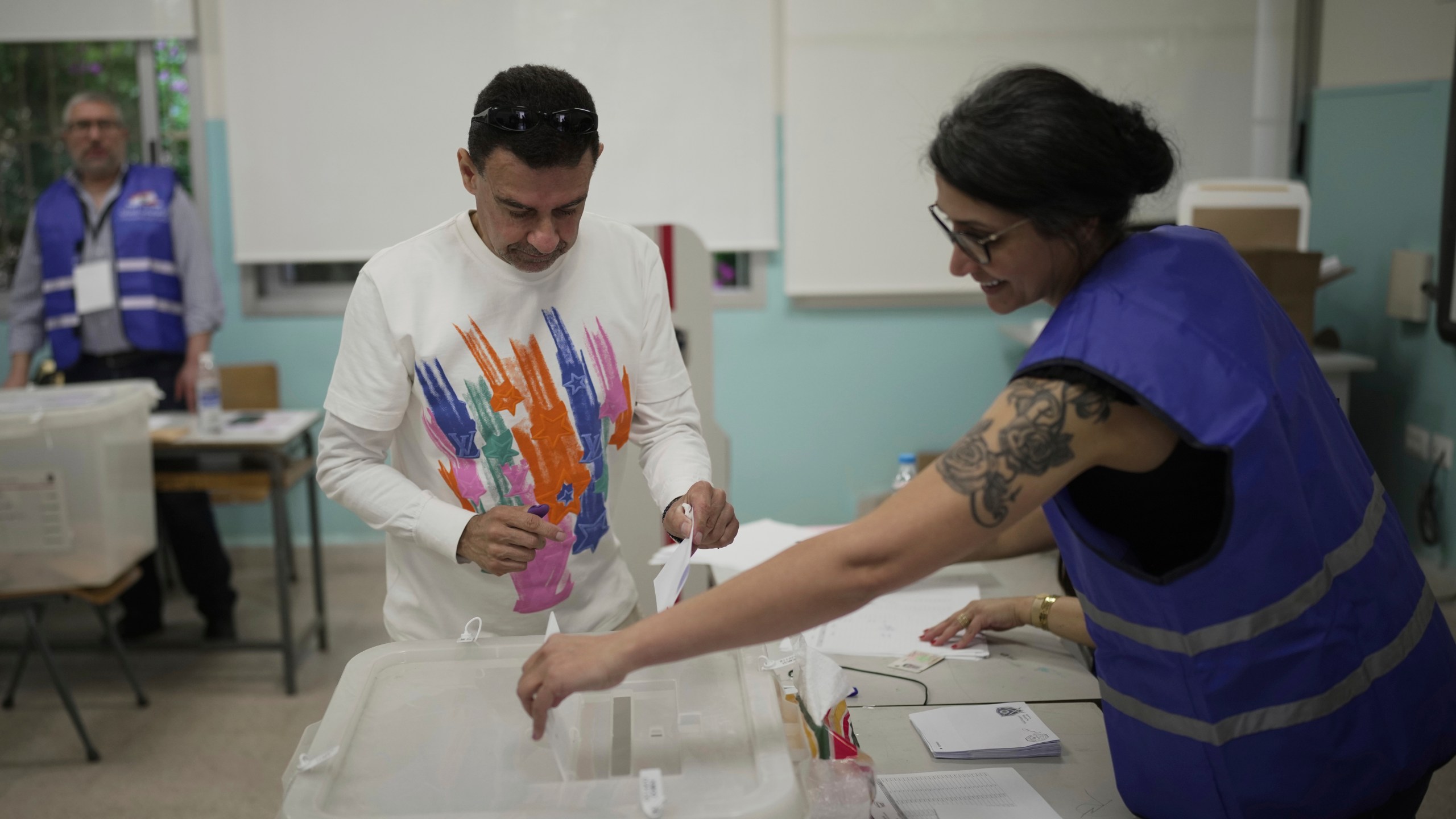 A Lebanese man casts his ballot at a polling station during municipal elections in the southern suburbs of Beirut, Lebanon, Sunday, May 4, 2025. (AP Photo/Hassan Ammar)