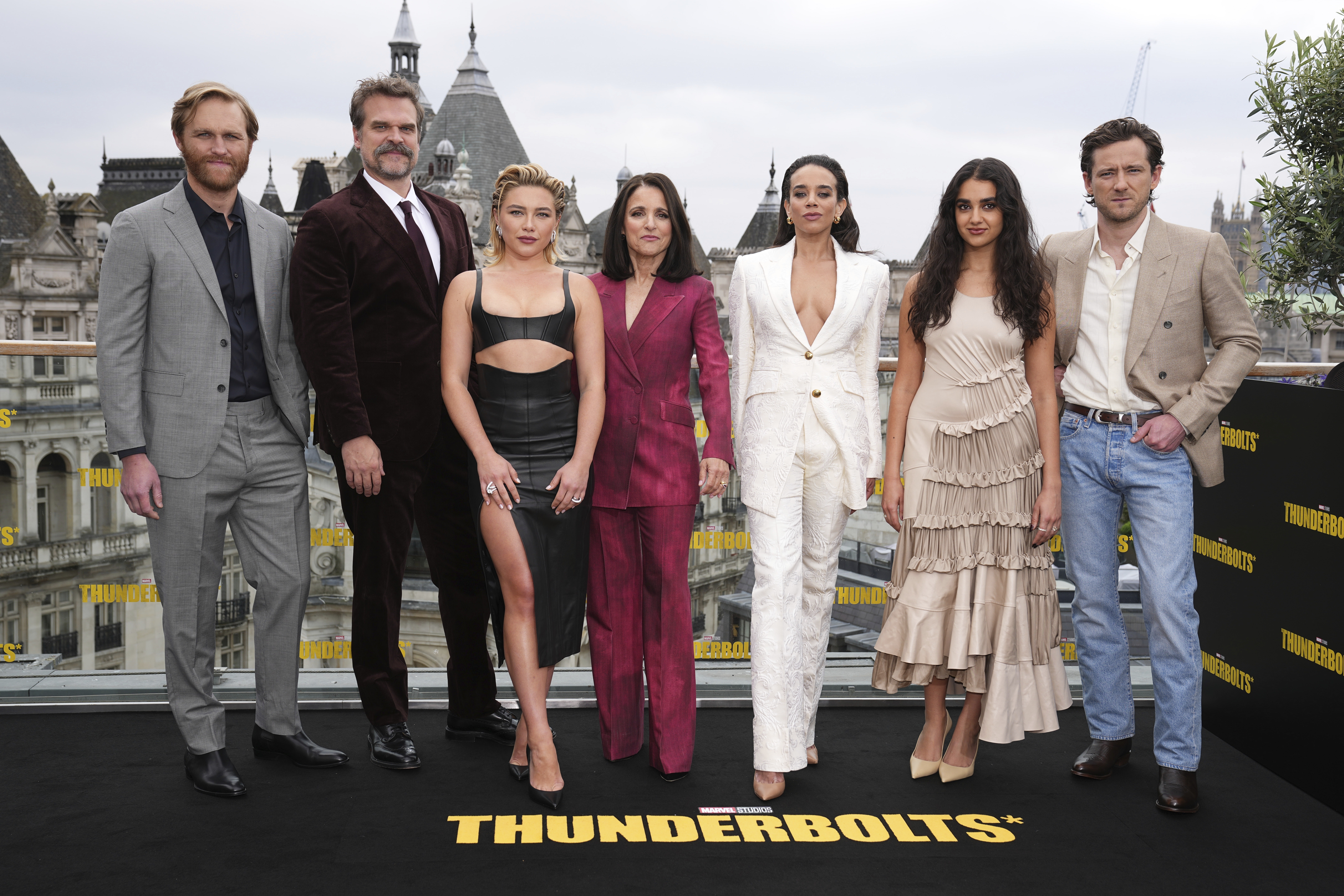 Wyatt Russell, from left, David Harbour, Florence Pugh, Julia Louis-Dreyfus, Hannah John-Kamen, Geraldine Viswanathan and Lewis Pullman pose for photographers at the photo call for the film 'Thunderbolts' on Thursday, April 24, 2025, in London. (Photo by Scott A Garfitt/Invision/AP)