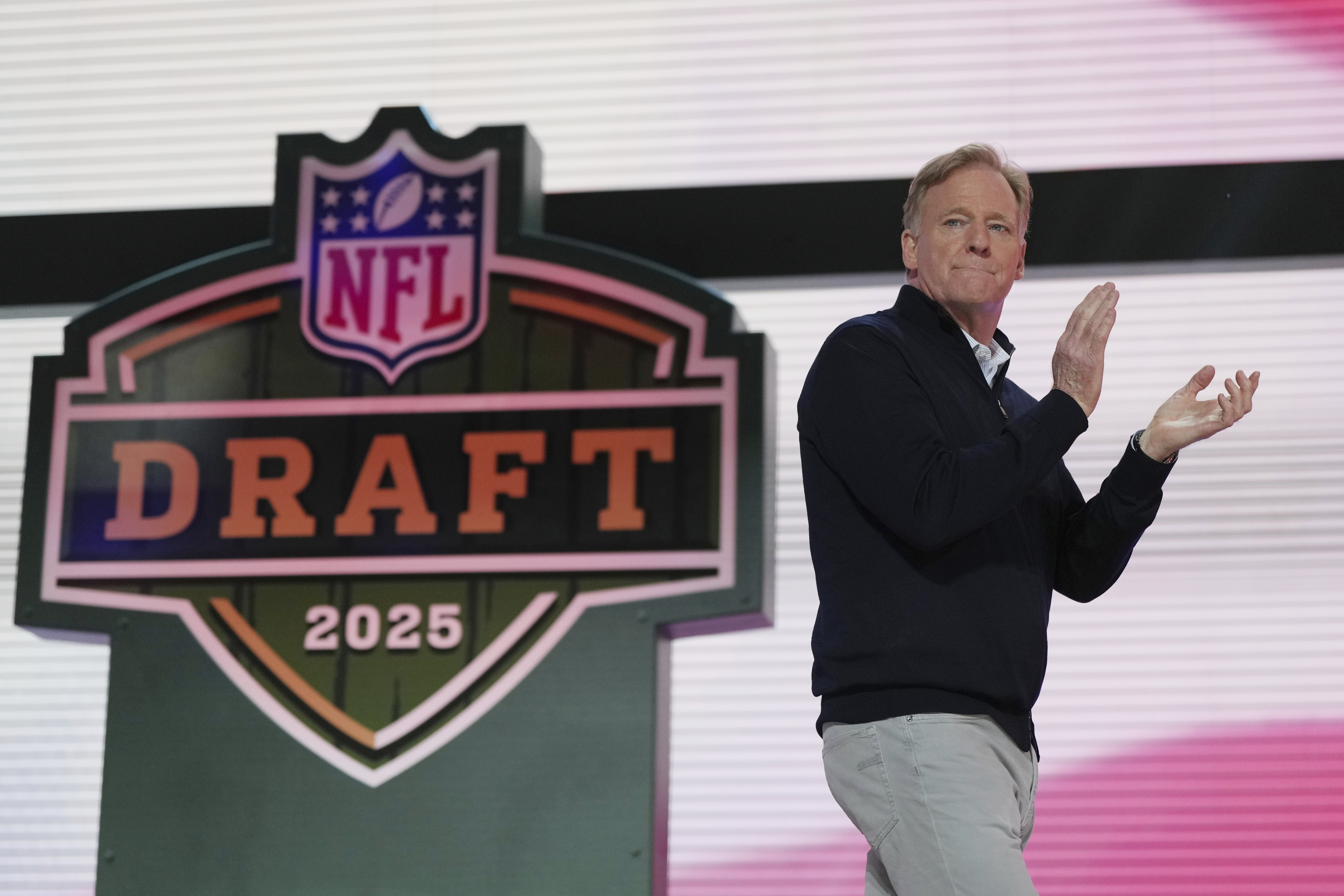 NFL Commissioner Roger Goodell motions on stage during the second round of the NFL football draft, Friday, April 25, 2025, in Green Bay, Wis. (AP Photo/Jeff Roberson)