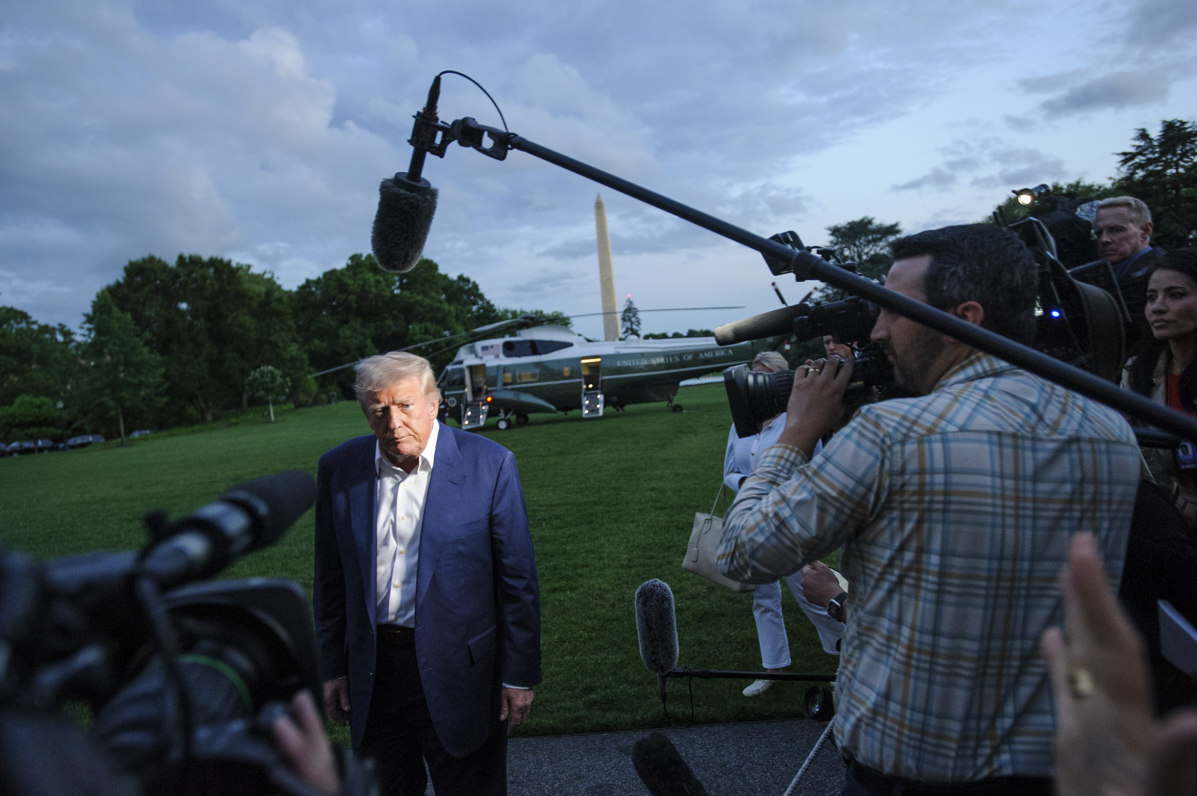 President Donald Trump speaks with reporters after disembarking Marine One upon arrival on the South Lawn of the White House in Washington, Sunday, May 4, 2025. (AP Photo/Rod Lamkey, Jr.)