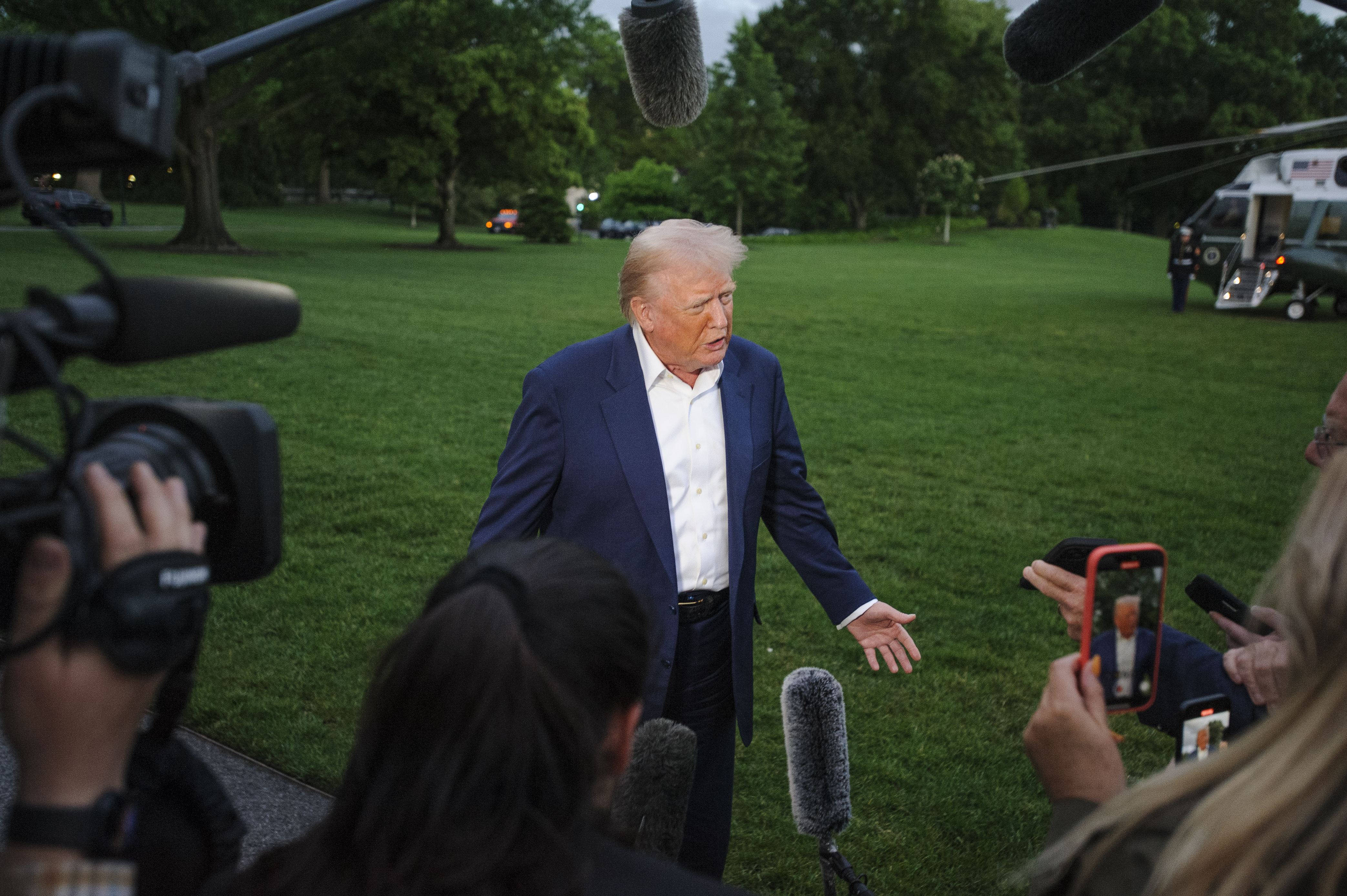 President Donald Trump speaks with reporters after disembarking Marine One upon arrival on the South Lawn of the White House in Washington, Sunday, May 4, 2025. (AP Photo/Rod Lamkey, Jr.)
