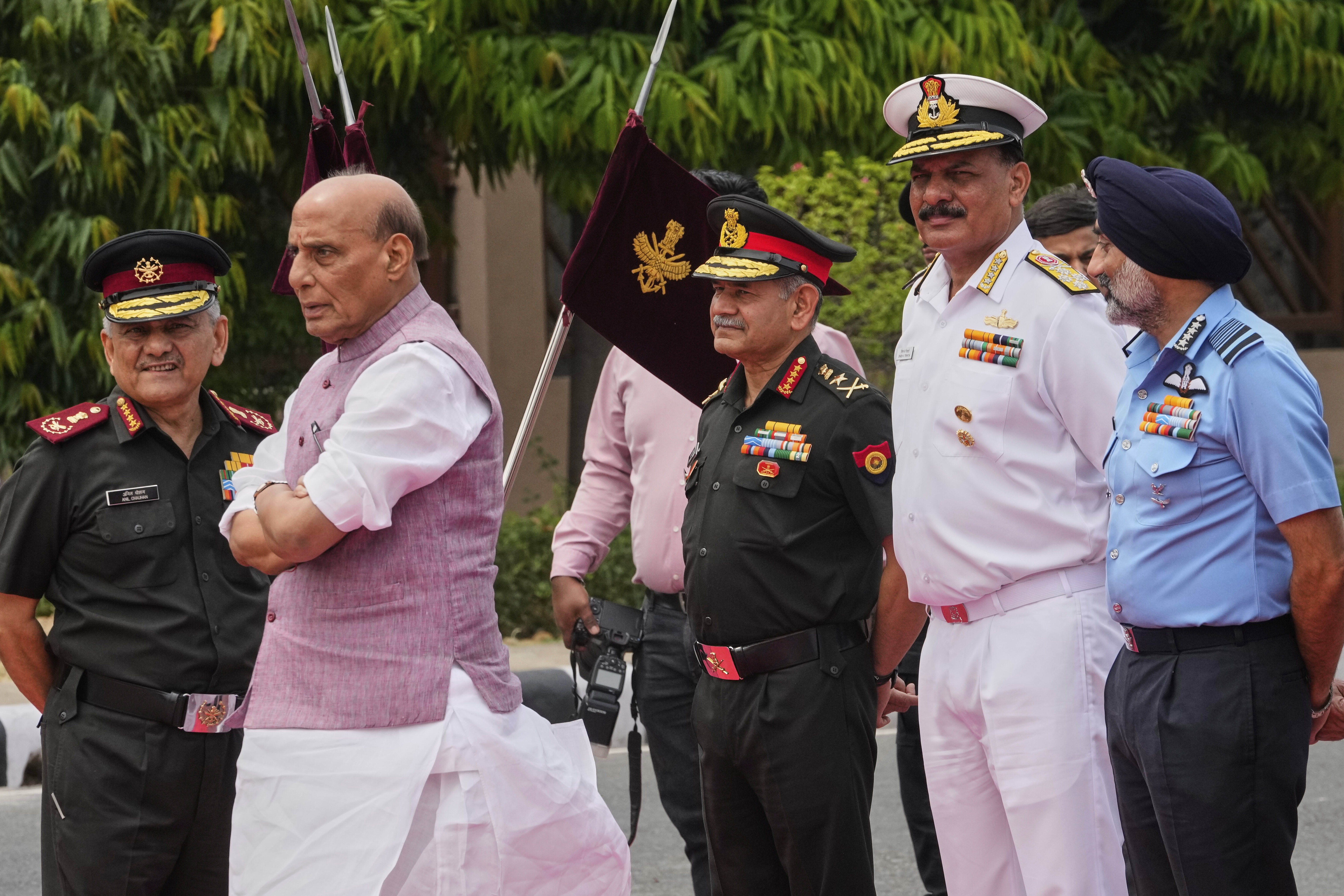 Indian Defense Minister Rajnath Singh, second left, with three Indian defense chiefs, Army General Upendra Dwivedi, third right, Naval Admiral Dinesh K Tripathi, second right, and Air Force Air Chief Marshal A P Singh, right, and Indian Chief of Defense Staff General Anil Chauhan, left, wait for the arrival of Japan's Defense Minister General Nakatani in New Delhi, India, Monday, May 5, 2025. (AP Photo/Manish Swarup)