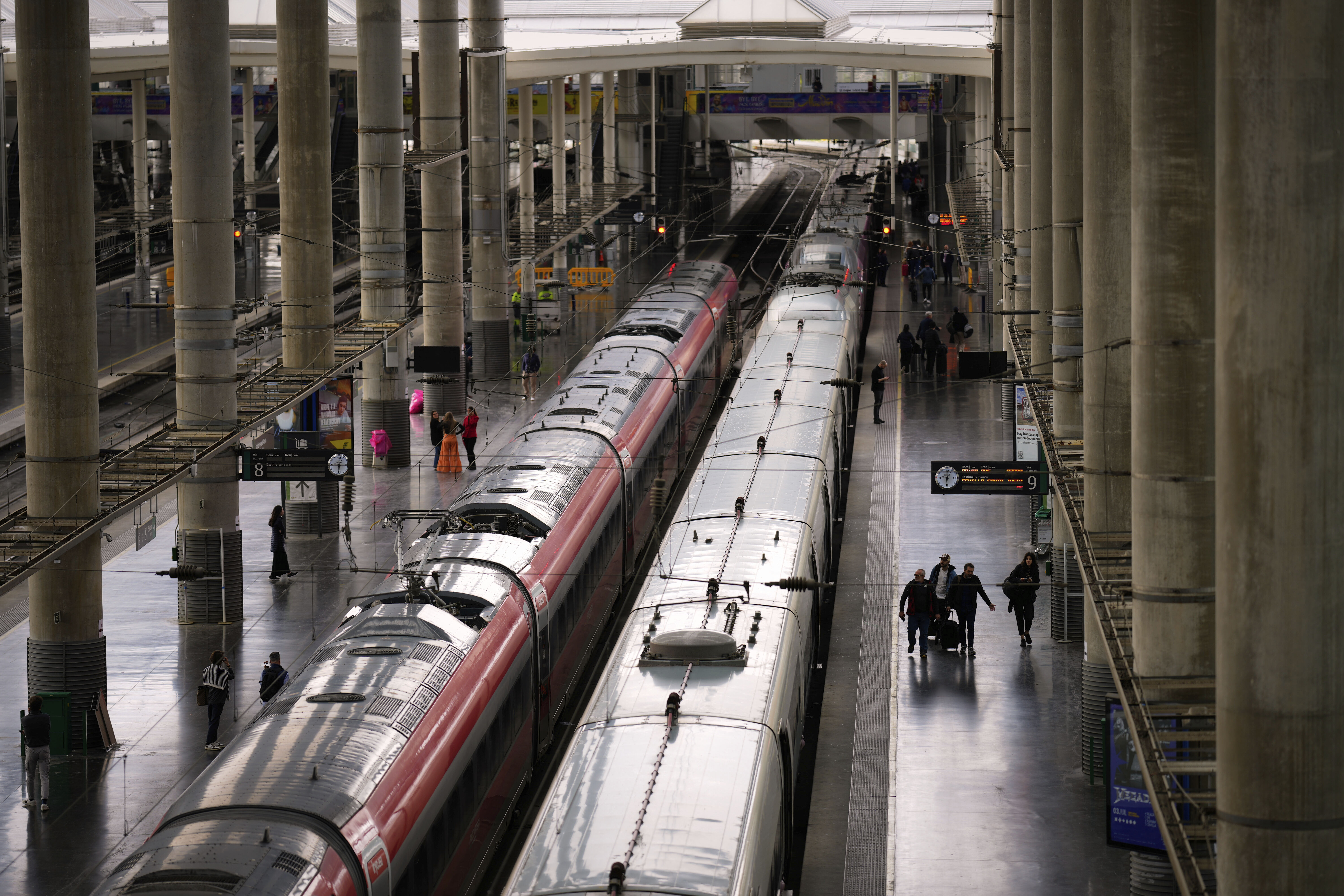 Trains are photographed on their platforms at the Madrid train station, Spain, Monday, May 5, 2025. (AP Photo/Manu Fernandez)