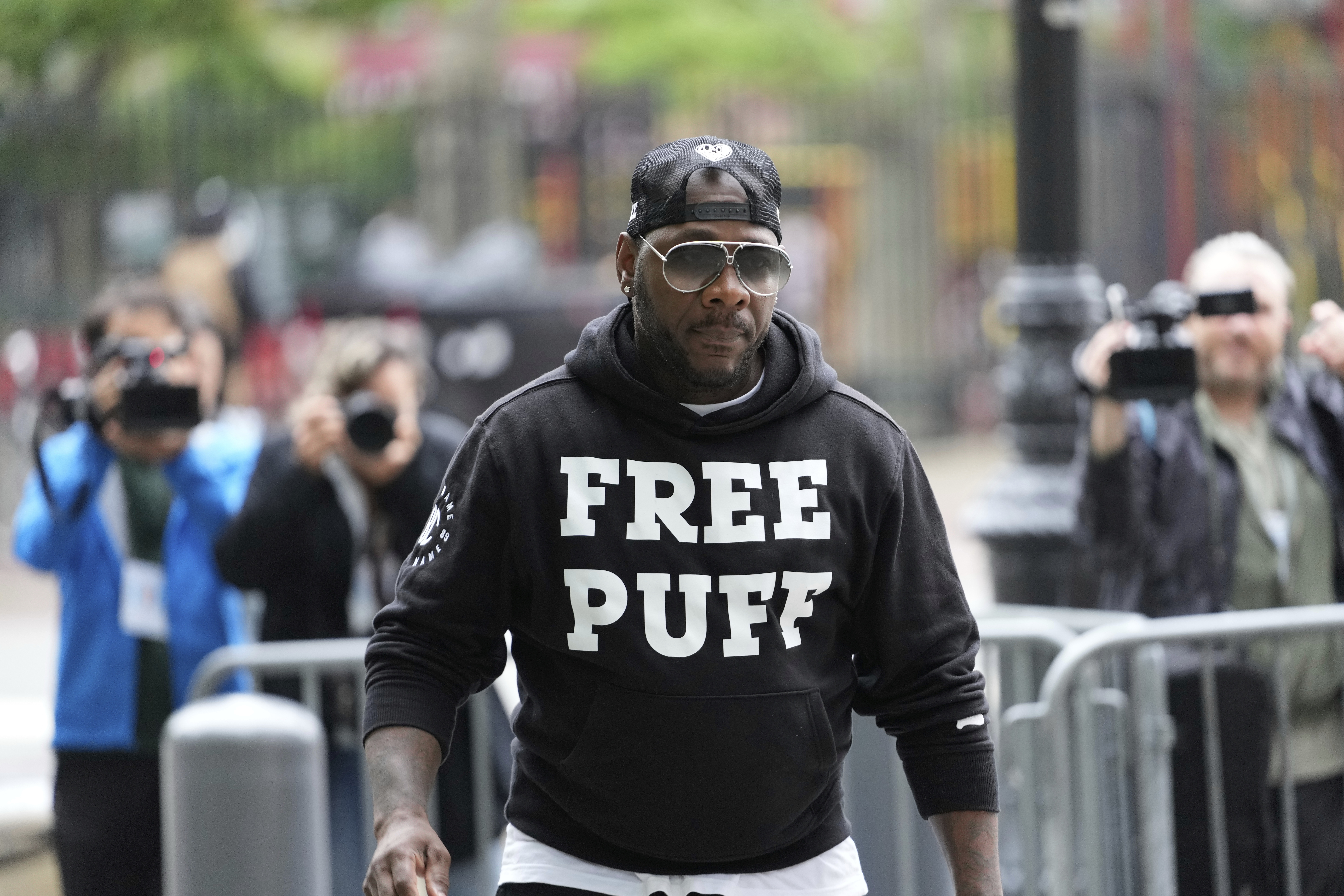 A man arrives to the federal courthouse wearing a shirt supporting Sean "Diddy" Combs in New York, Monday, May 5, 2025. (AP Photo/Seth Wenig)