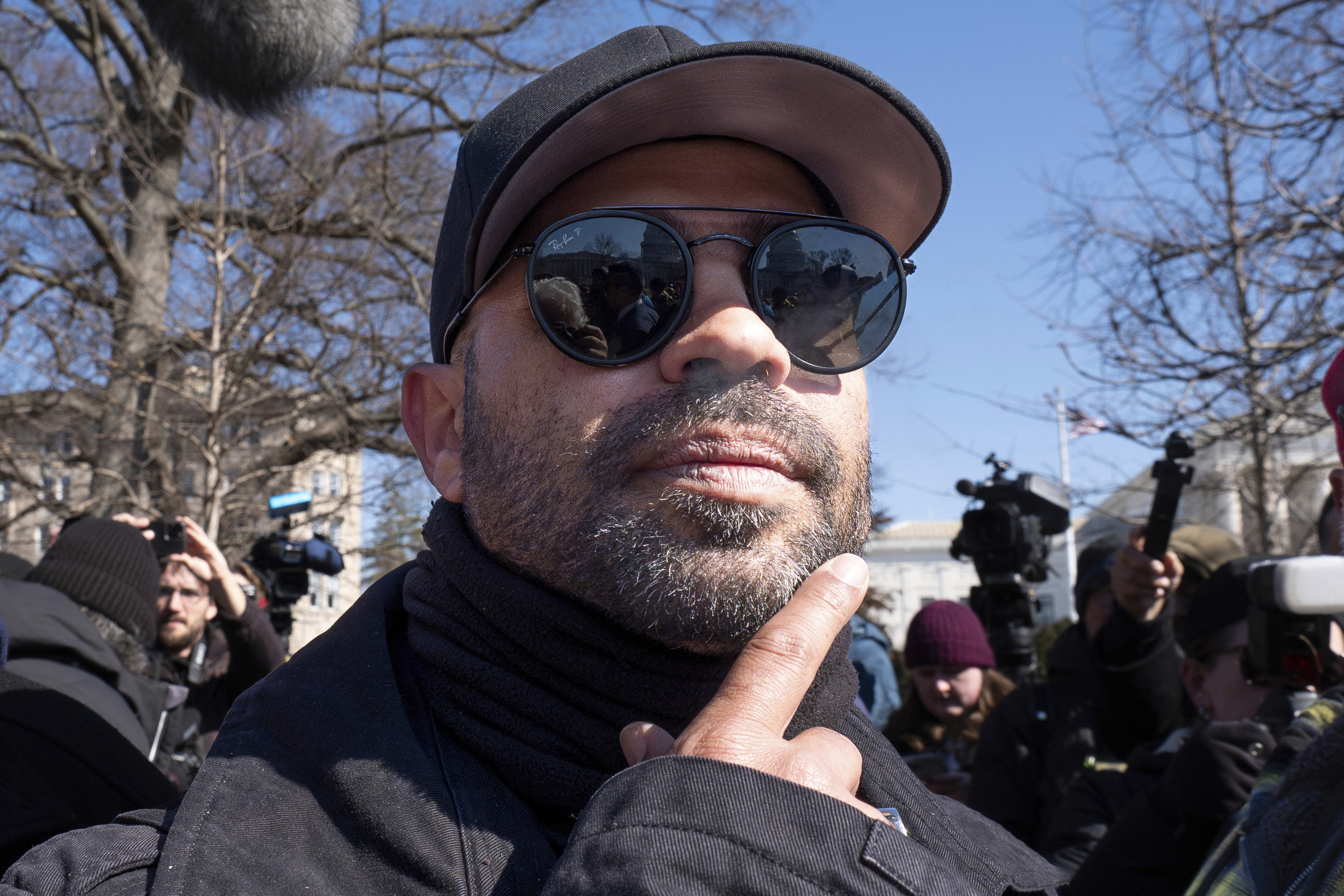 FILE - Former Proud Boys leader Enrique Tarrio attends a news conference outside the U.S. Capitol in Washington, Feb. 21, 2025. (AP Photo/J. Scott Applewhite, File)