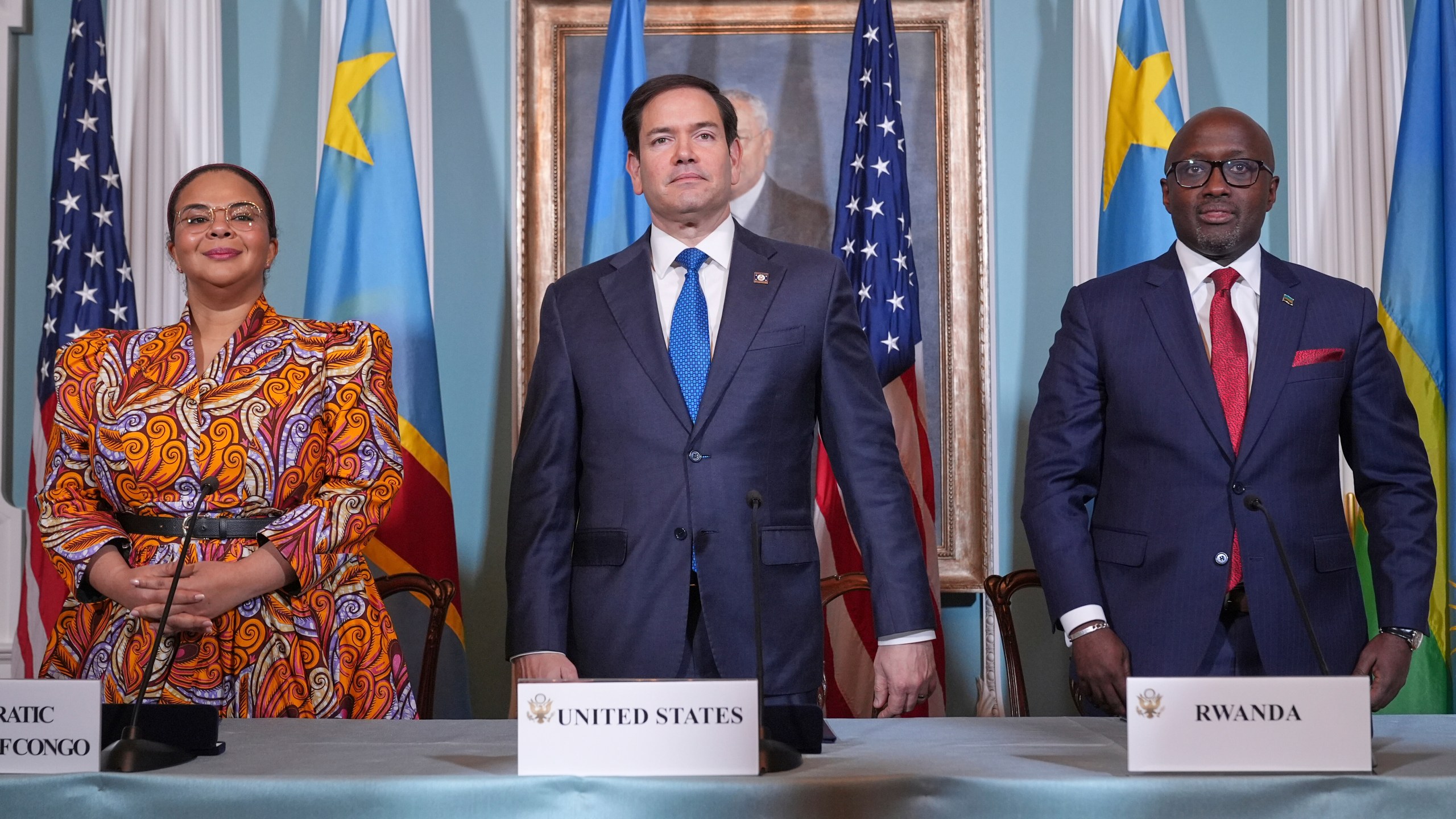 FILE - Secretary of State Marco Rubio hosts a signing ceremony in which Congo's Foreign Minister Therese Kayikwamba Wagner, left, and Rwanda's Foreign Minister Olivier Nduhungirehe, right, pledge to work toward a peace deal on Friday, April 25, 2025, at the State Department in Washington. (AP Photo/Jacquelyn Martin, File)