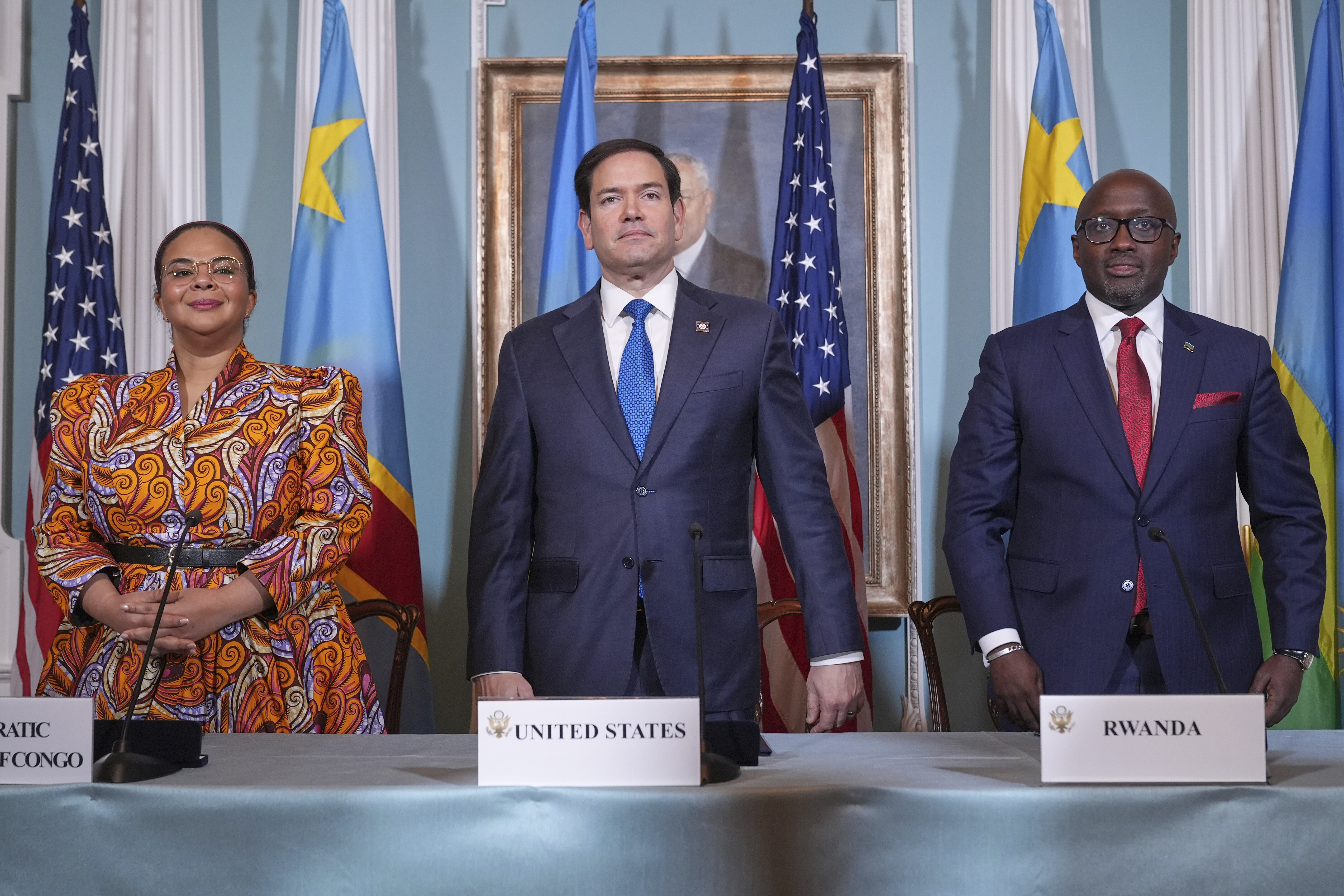 FILE - Secretary of State Marco Rubio hosts a signing ceremony in which Congo's Foreign Minister Therese Kayikwamba Wagner, left, and Rwanda's Foreign Minister Olivier Nduhungirehe, right, pledge to work toward a peace deal on Friday, April 25, 2025, at the State Department in Washington. (AP Photo/Jacquelyn Martin, File)