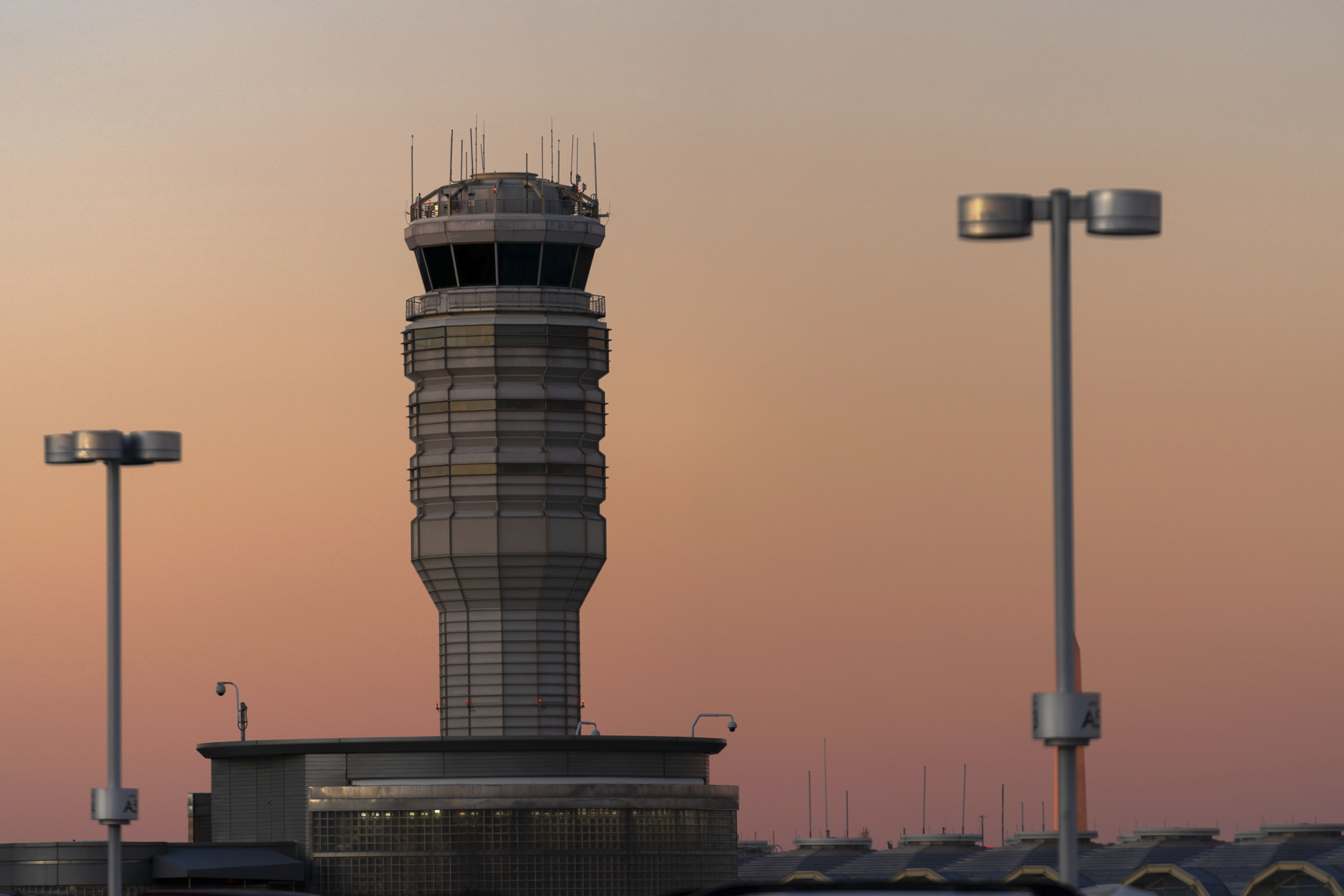 FILE - The air traffic control tower at Ronald Reagan Washington National Airport is seen at sunset, Feb. 1, 2025, in Arlington, Va.. (AP Photo/Jose Luis Magana, file)