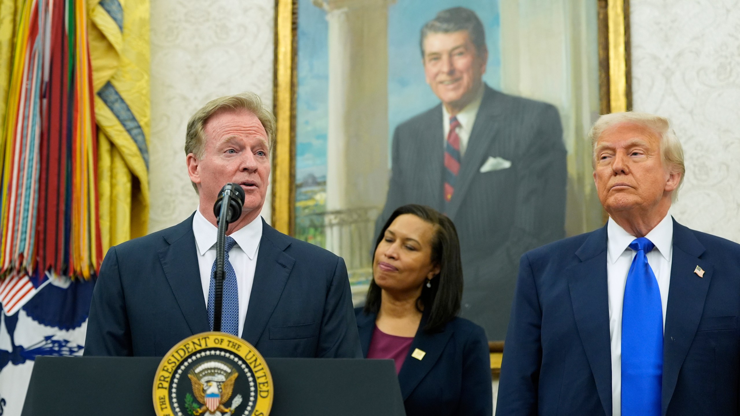 NFL Commissioner Roger Goodell, from left, speaks as District of Columbia Mayor Muriel Bowser and President Donald Trump listen during an event to announce that the 2027 NFL Draft will be held on the National Mall, in the Oval Office of the White House, Monday, May 5, 2025, in Washington. (AP Photo/Alex Brandon)
