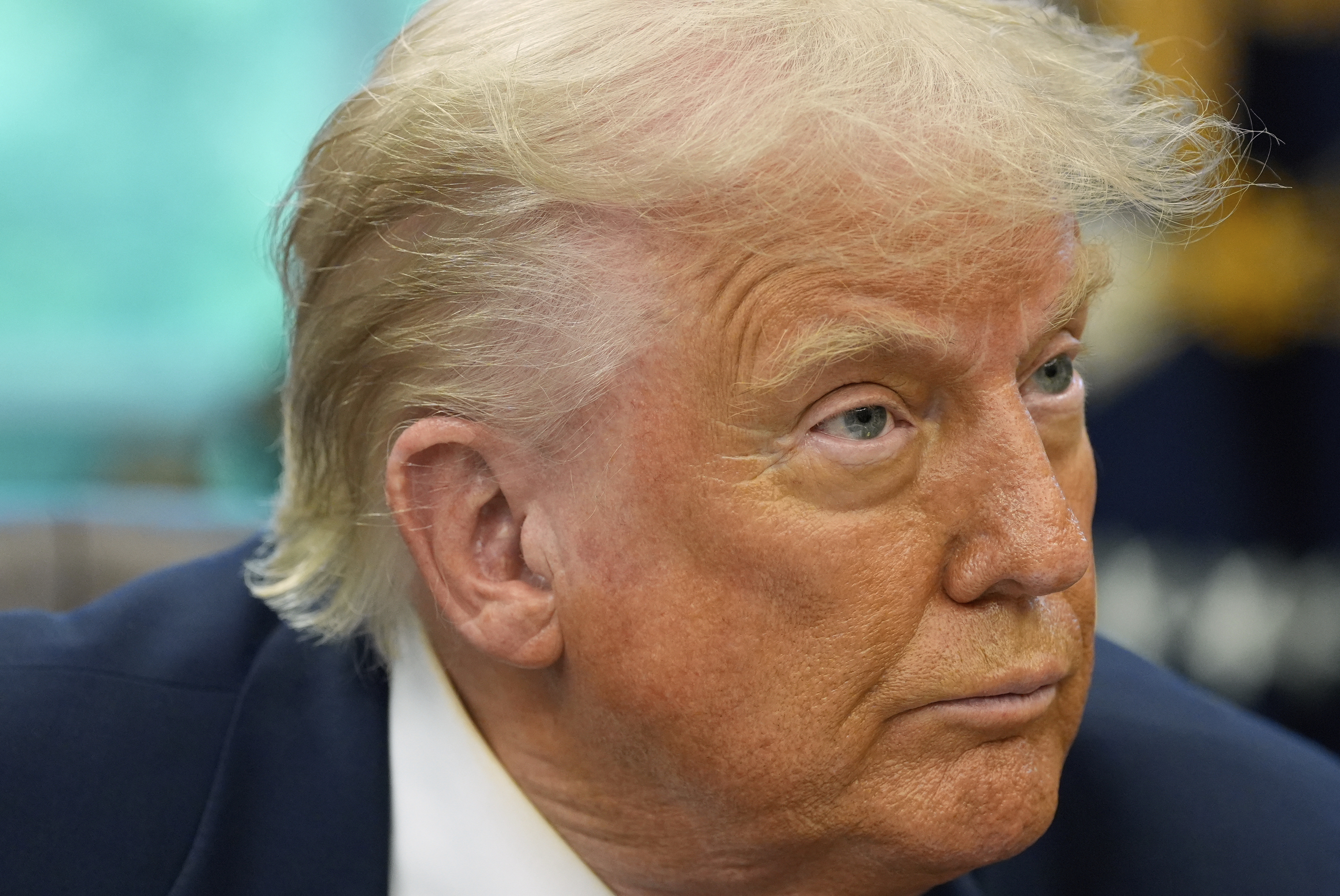 President Donald Trump speaks with reporters as he signs executive orders and proclamations in the Oval Office of the White House, Monday, May 5, 2025, in Washington. (AP Photo/Alex Brandon)