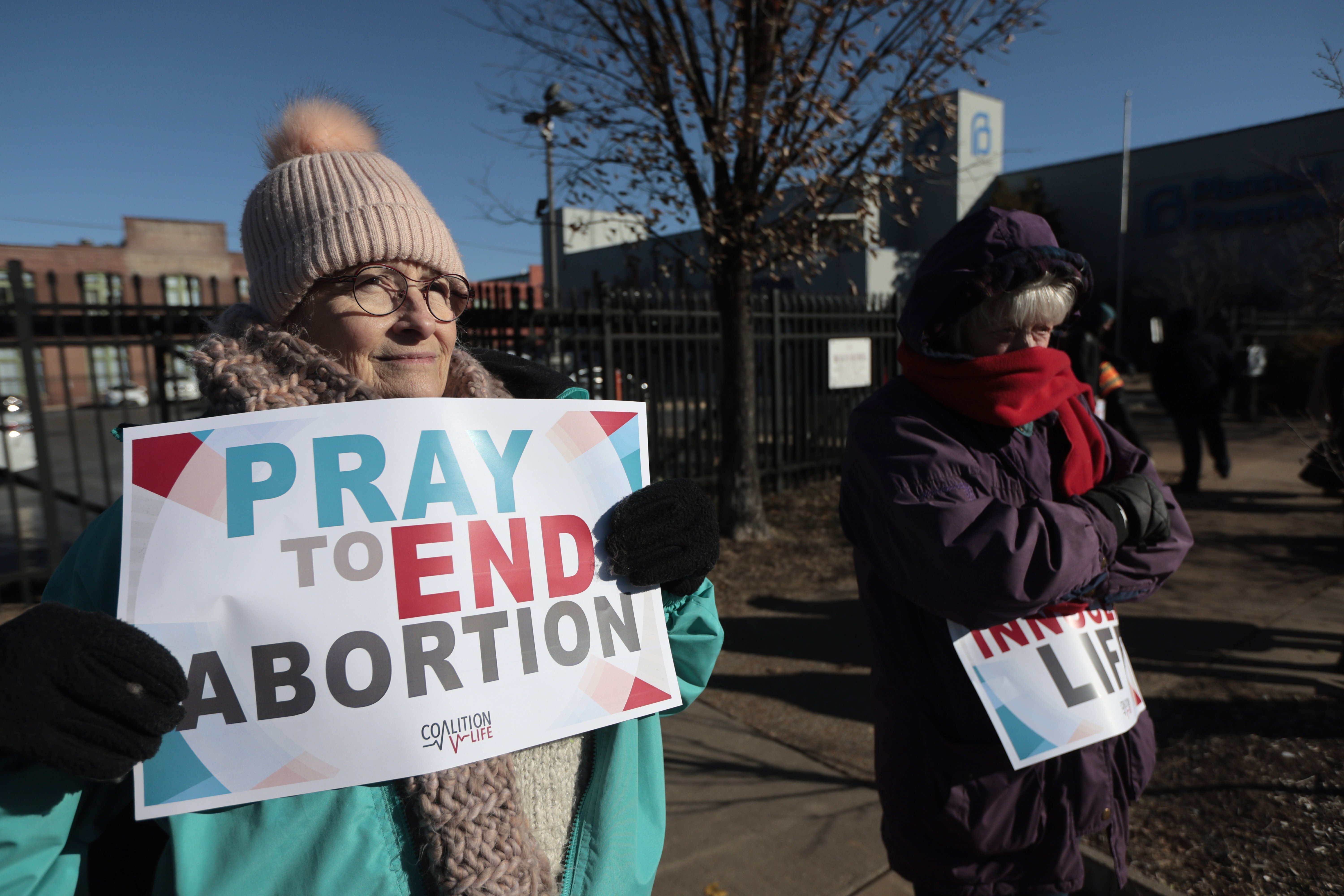 FILE - Anti-abortion protesters Jean Bullock, left, and Sue Dunn, demonstrate outside Planned Parenthood Great Rivers, Dec. 5, 2024, at in St. Louis, Mo. (Laurie Skrivan/St. Louis Post-Dispatch via AP, File)