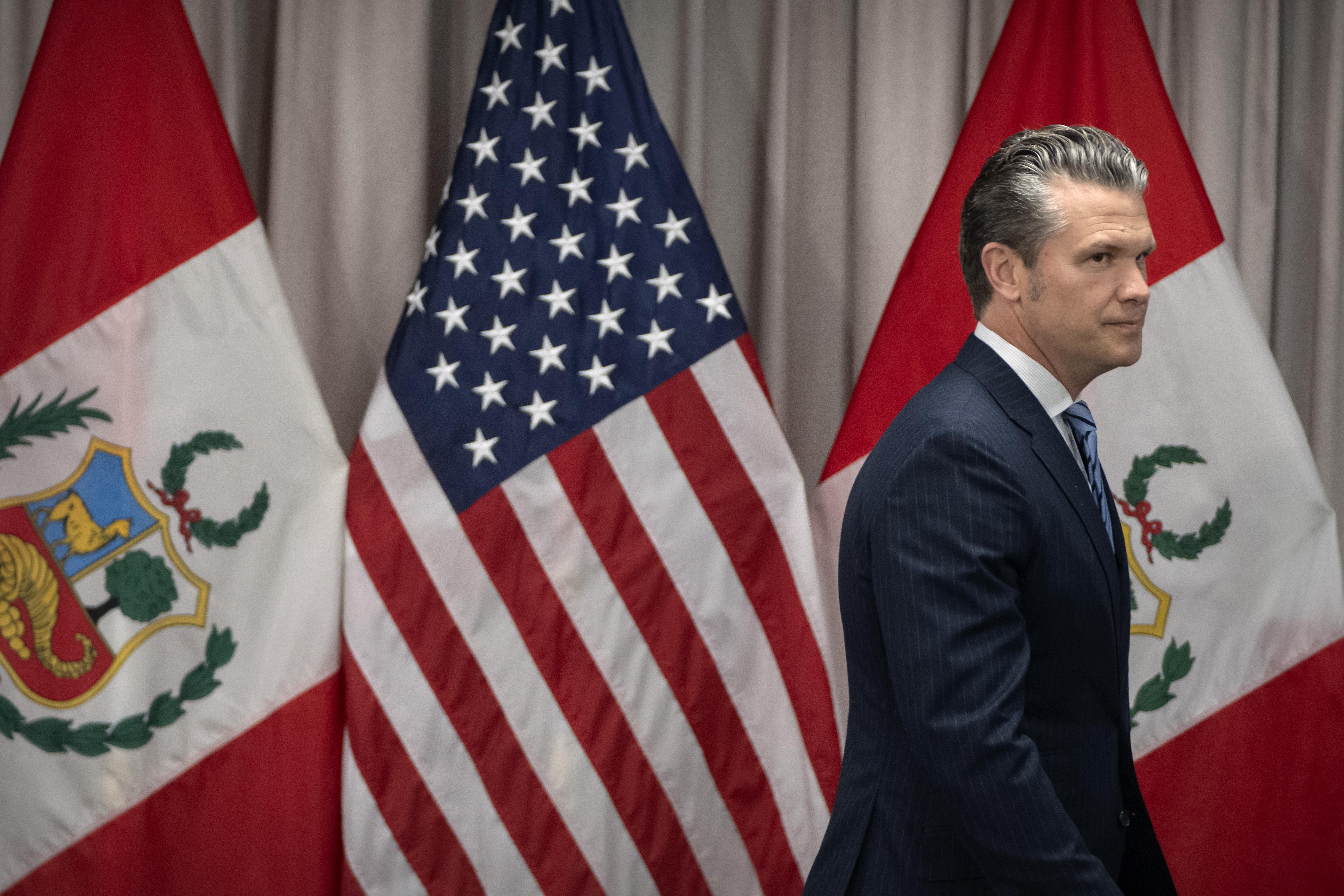 Secretary of Defense Pete Hegseth arrives for a meeting with Peru's Foreign Affairs Minister Elmer Schialer and Peru's Minister of Defense Walter Astudillo at the Pentagon, Monday, May 5, 2025, in Washington. (AP Photo/Mark Schiefelbein)