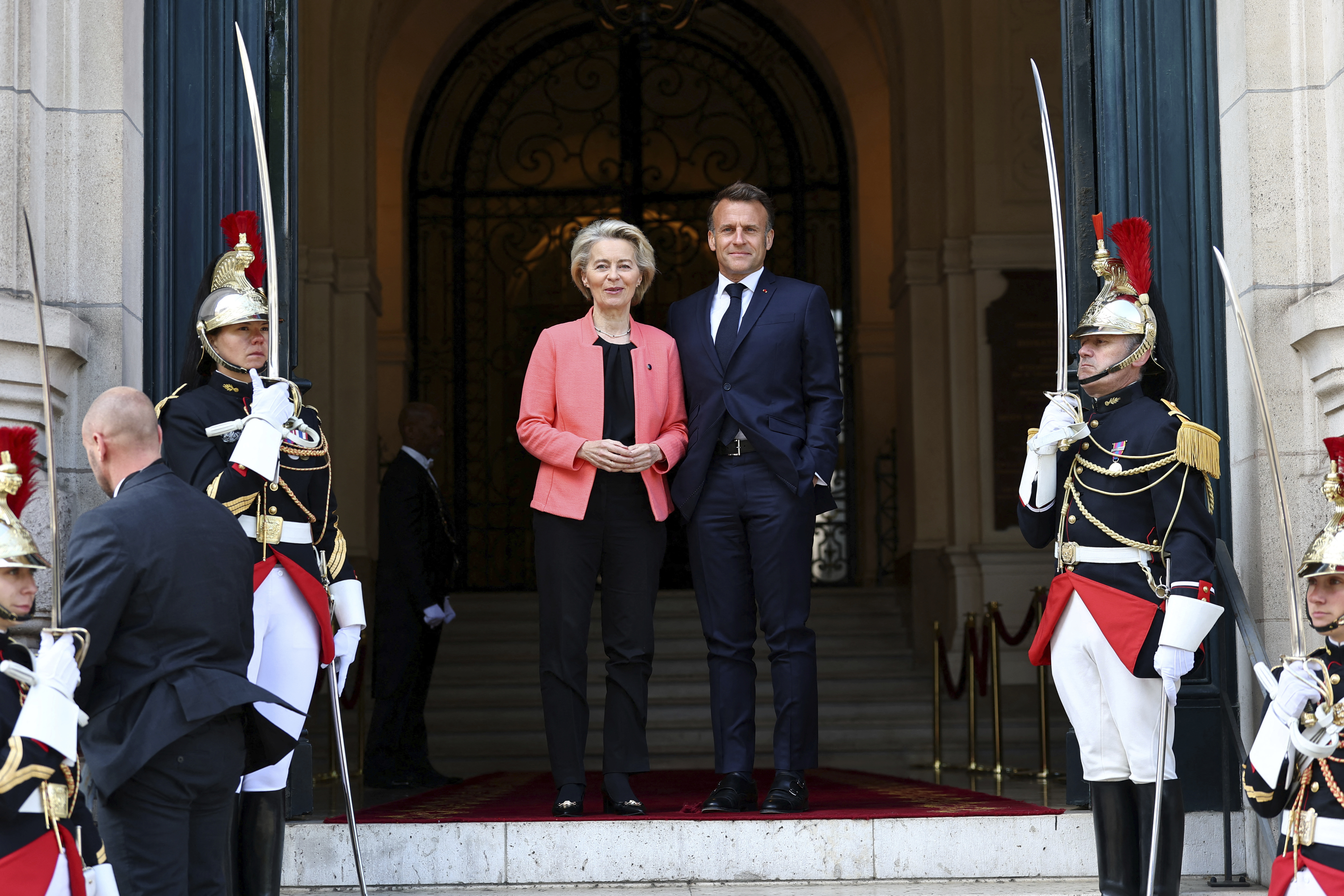 French President Emmanuel Macron welcomes European Commission President Ursula Von der Leyen as she arrives at the "Choose Europe for Science" event, to encourage researchers and scientists from all over the world to practice in Europe, at the Sorbonne University in Paris, Monday, May 5, 2025.(Gonzalo Fuentes/Pool via AP)