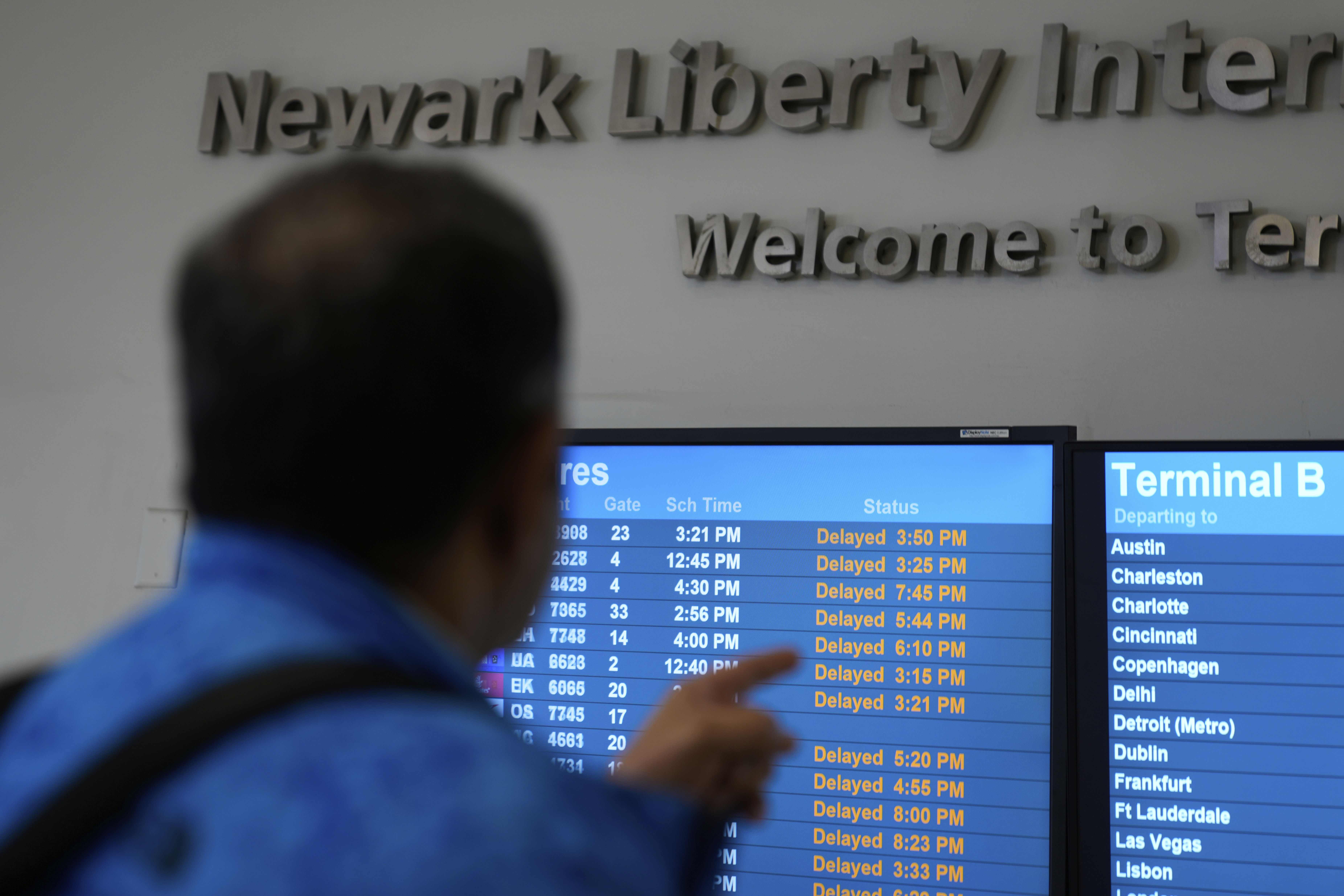 A display shows the status of flights at Newark Liberty International Airport in Newark, N.J., Monday, May 5, 2025. (AP Photo/Seth Wenig)