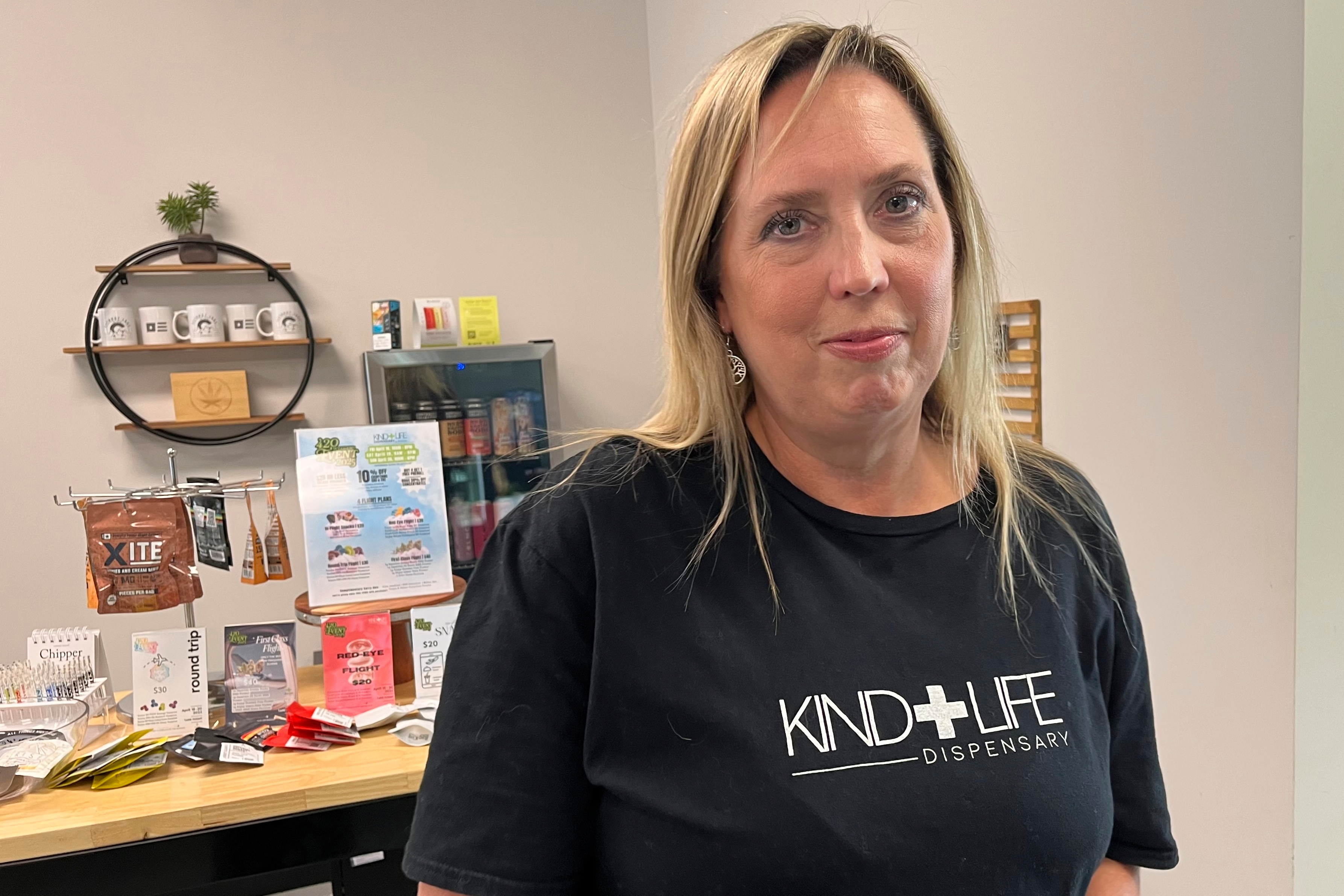 Andrea Watkins, co-owner of Kind Life Dispensary business, that sells an array of products containing hemp-based THC, poses for a photo in Lincoln, Neb., May 1, 2025. (AP Photo/Margery Beck)