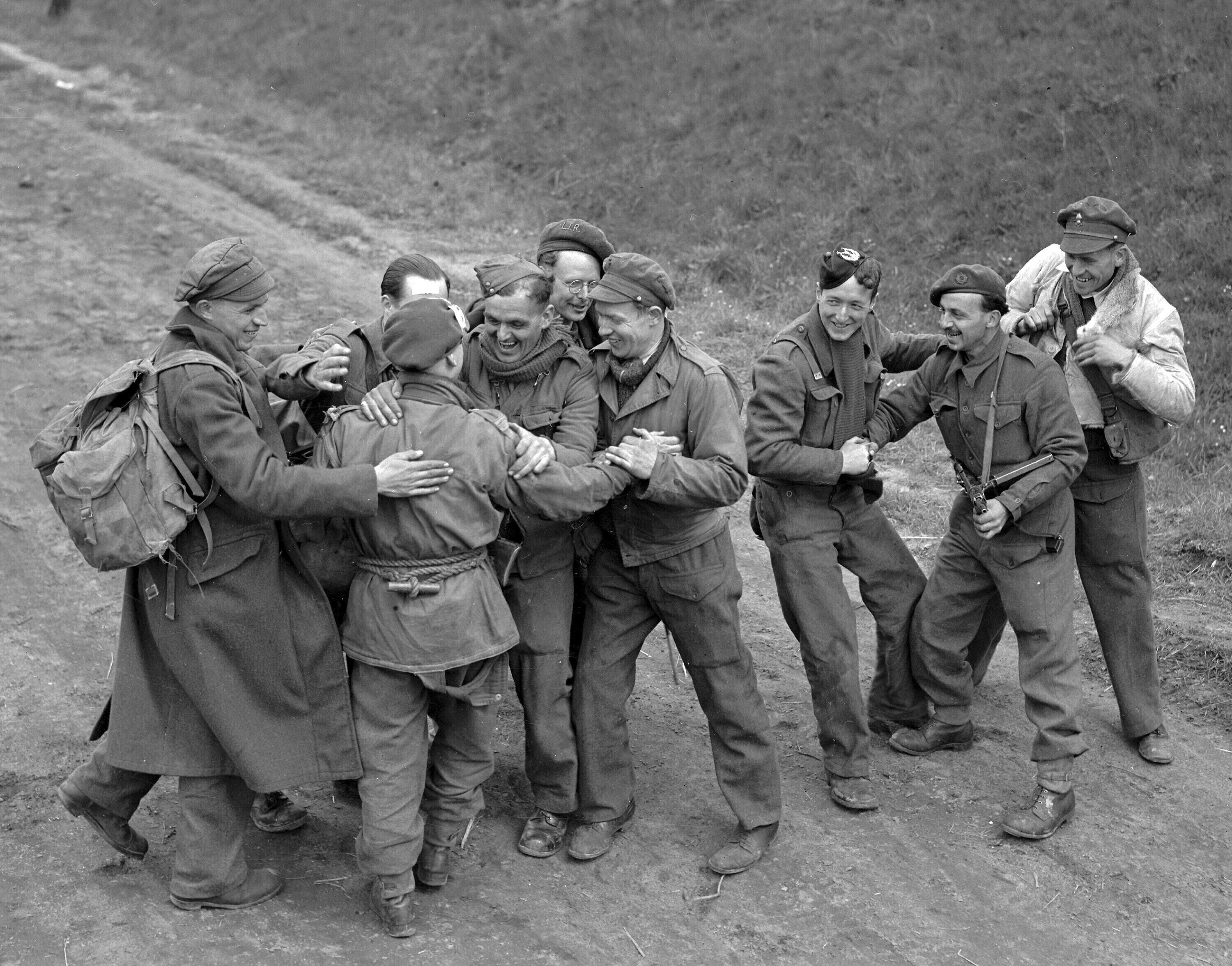 FILE - Recently released British prisoners of war meet up with a parachute recce party while marching towards Allied lines, in Germany May 4, 1945. German authorities have recently released 8,000 British prisoners of war. (AP Photo/Eddie Worth, File)