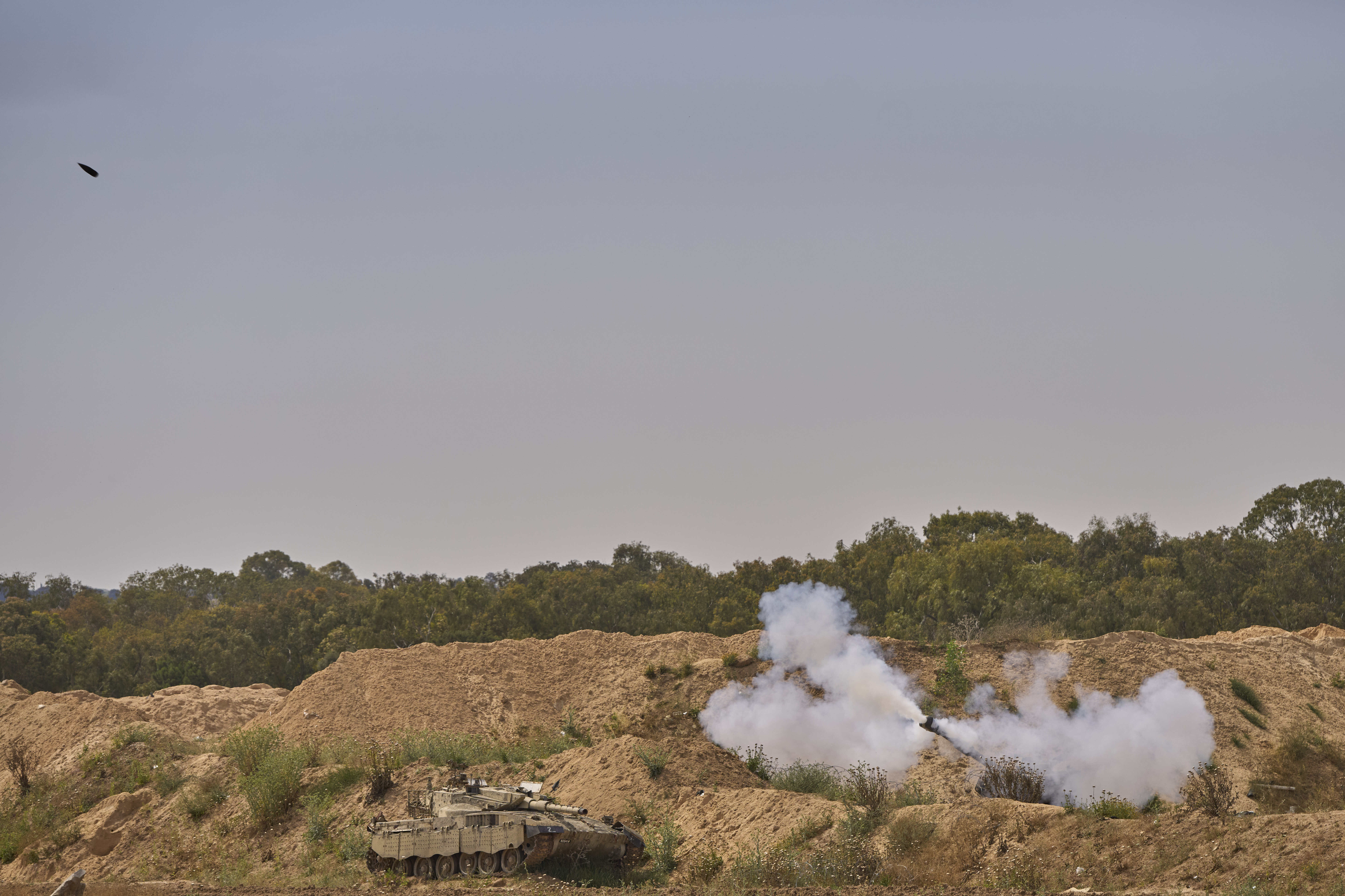 An Israeli mobile artillery unit fires a shell from southern Israel towards the Gaza Strip, in a position near the Israel-Gaza border on Tuesday, May 6, 2025. (AP Photo/Ohad Zwigenberg)