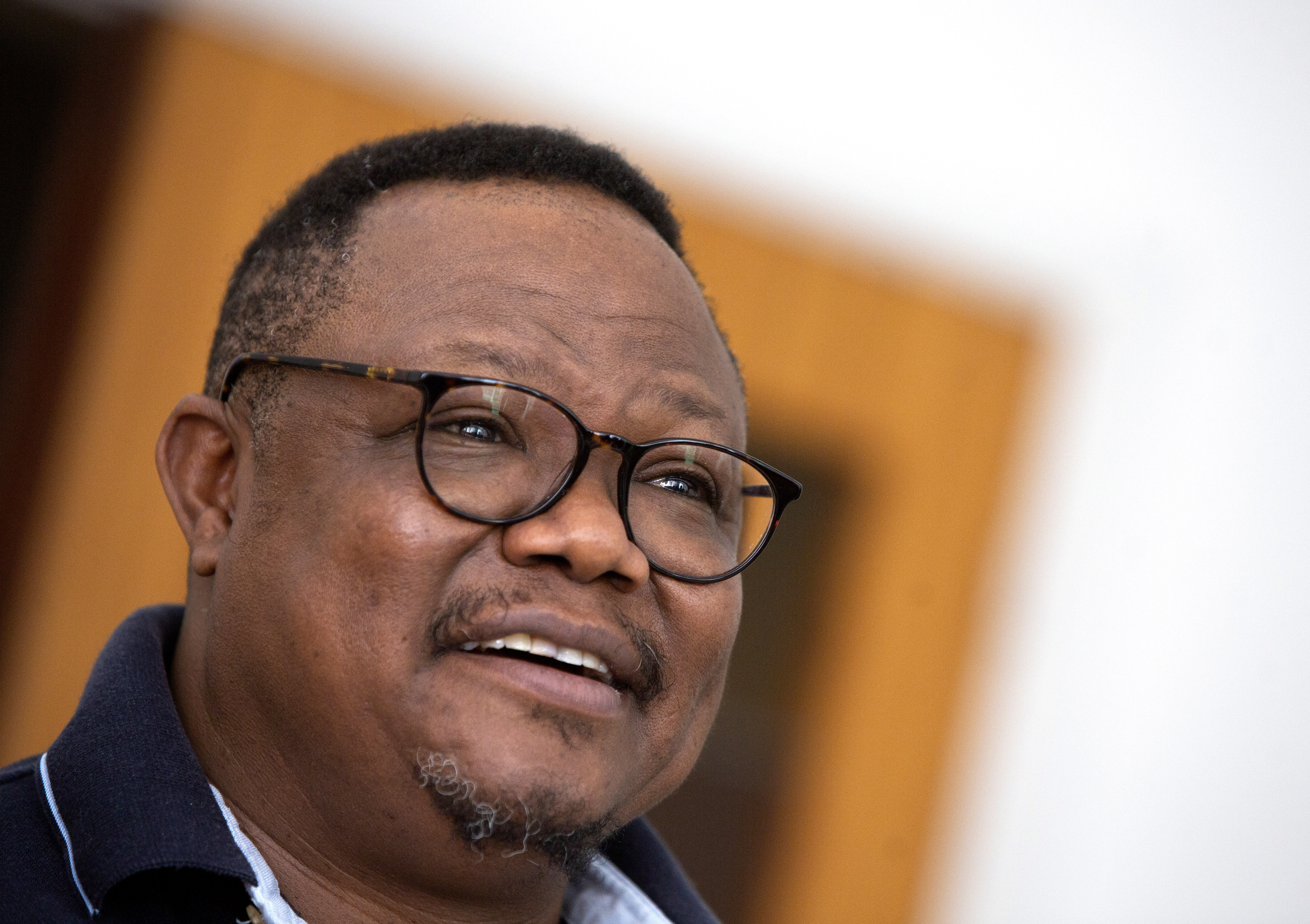 FILE - Exiled Tanzanian opposition leader Tundu Lissu gives an interview to The Associated Press in Tienen, Belgium on Friday, March 19, 2021. (AP Photo/Virginia Mayo)
