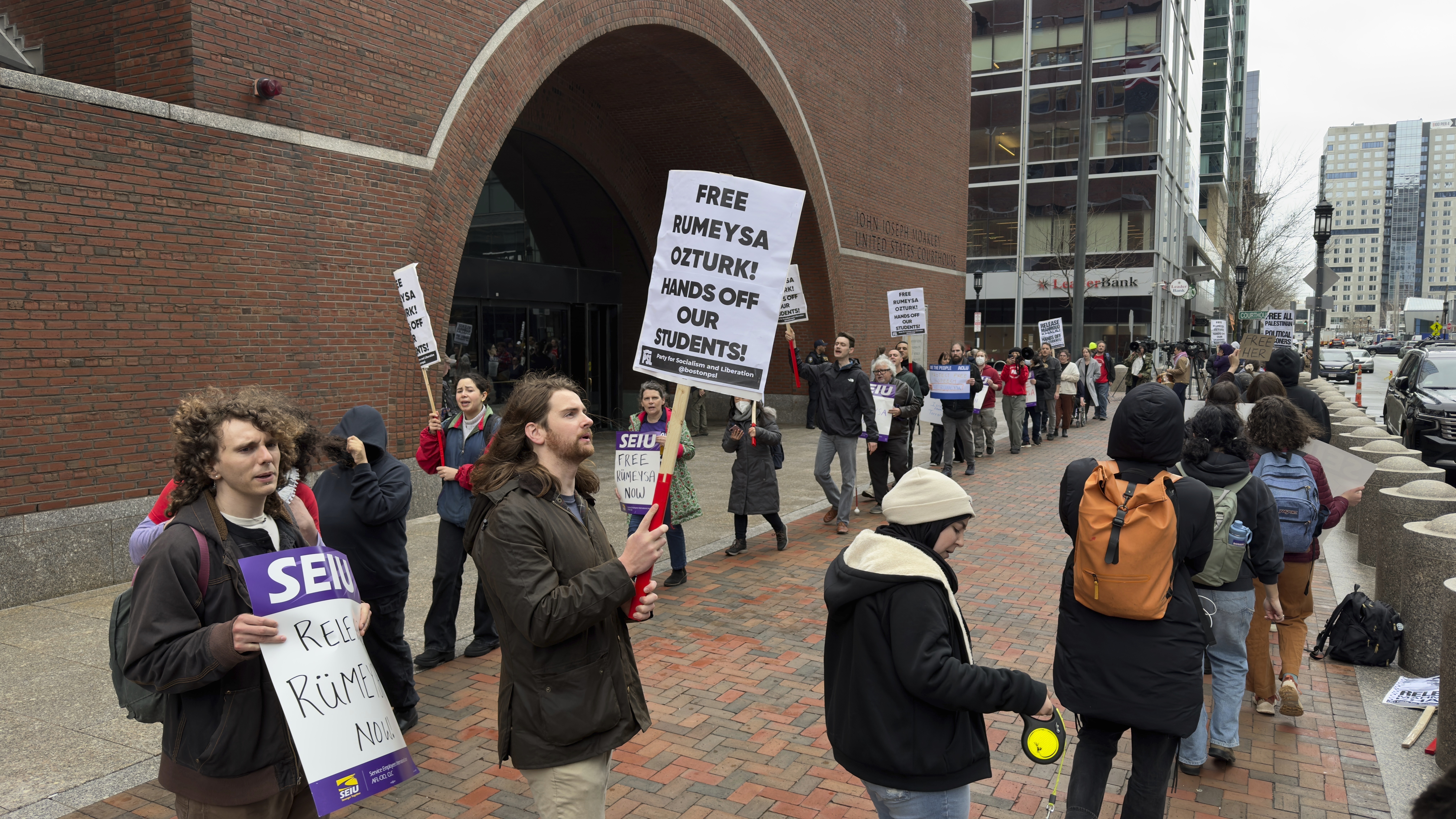 FILE - Protesters gather outside federal court during a hearing for Rumeysa Ozturk, a Tufts University doctoral student from Turkey who was detained by immigration authorities, April 3, 2025, in Boston. (AP Photo/Rodrique Ngowi, File)