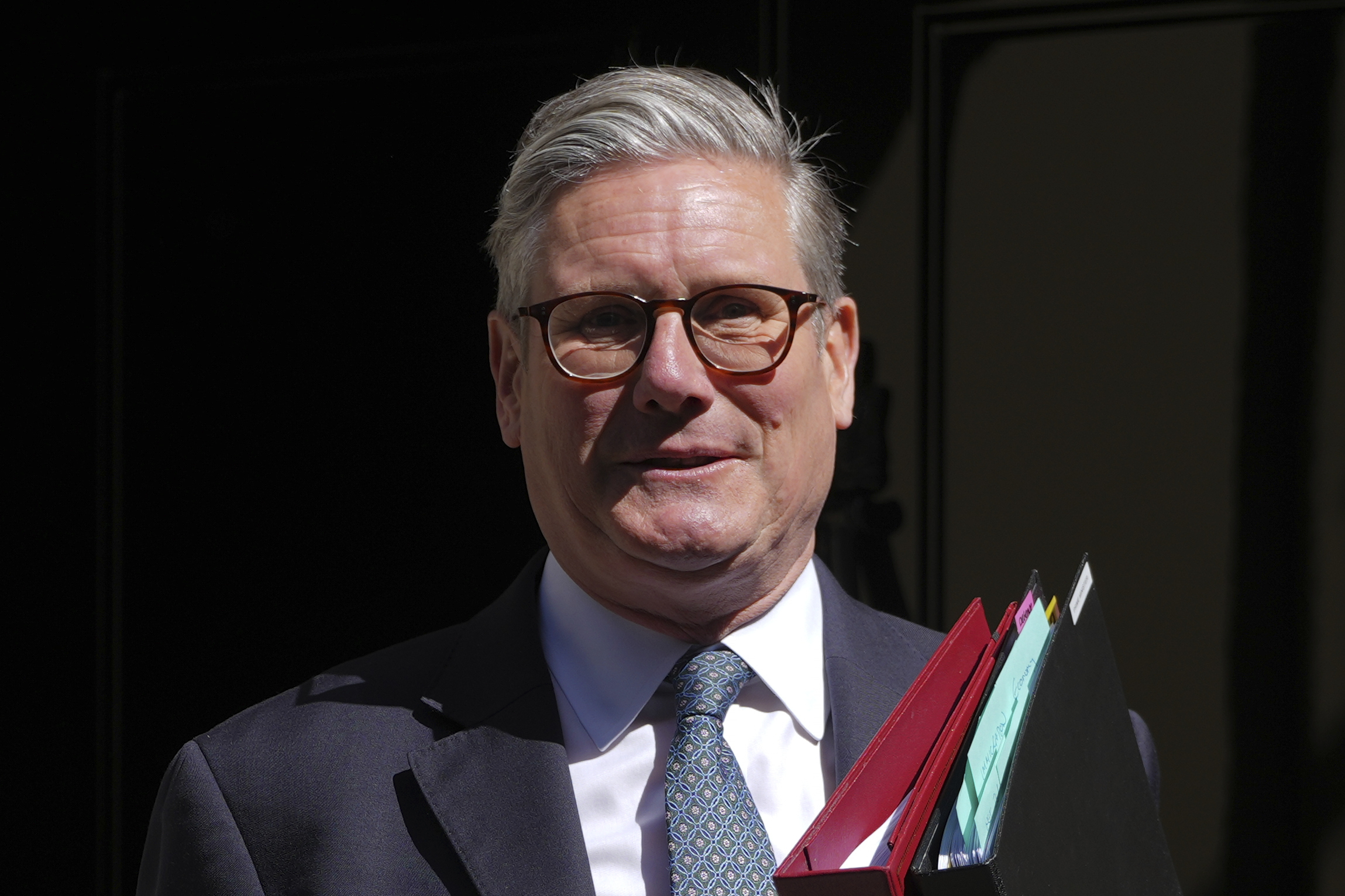 Britain's Prime Minister Keir Starmer leaves 10 Downing Street to attend the weekly Prime Ministers' Questions session in parliament in London, Wednesday, April 30, 2025. (AP Photo/Kin Cheung)