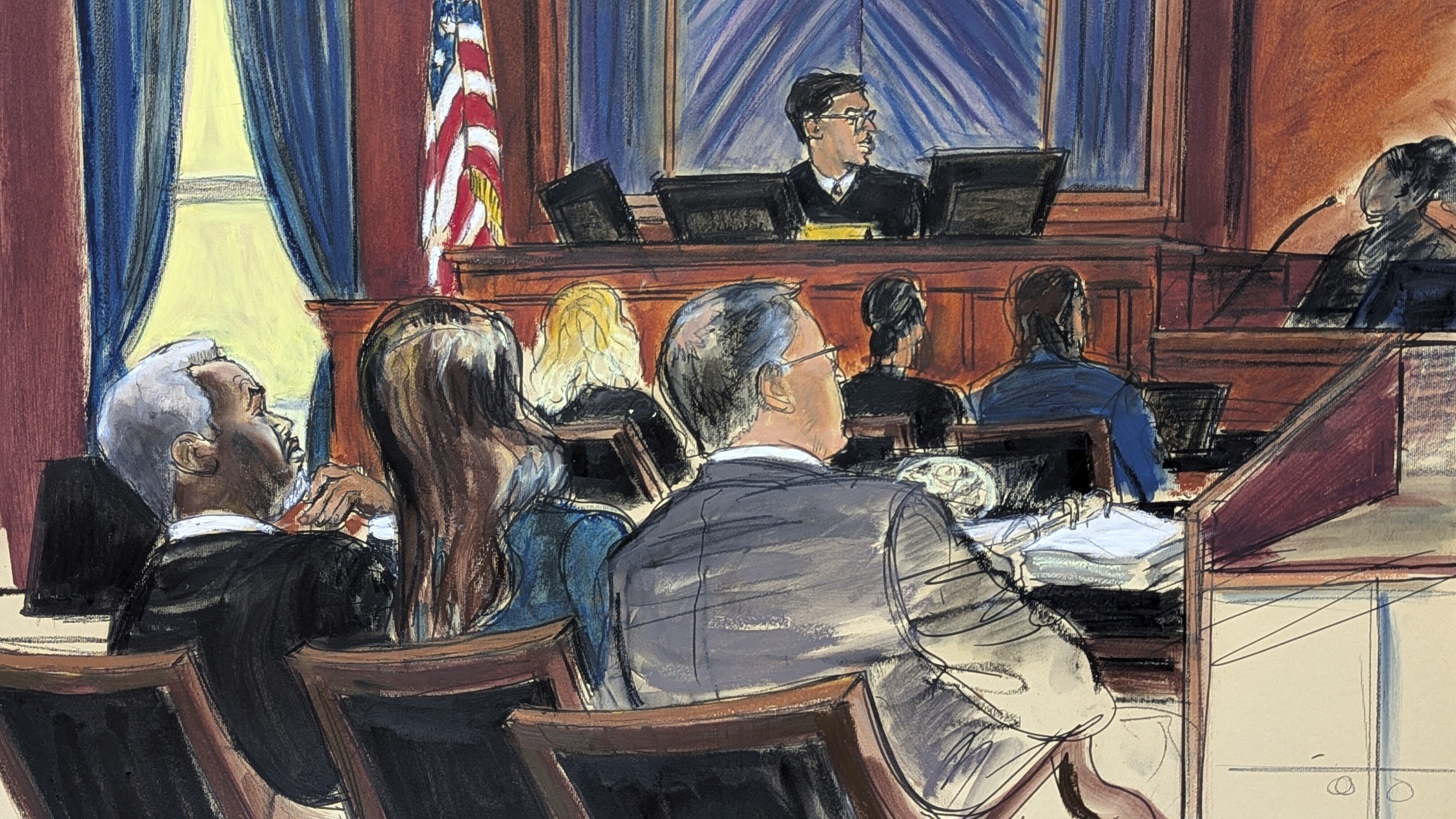 Sean 'Diddy' Combs, far left, looks on from the defense table with his attorneys, as a prospective juror, far right, answers questions posed by Judge Arun Subramanian, center, at Manhattan federal court, Monday, May 5, 2025, in New York. (Elizabeth Williams via AP)