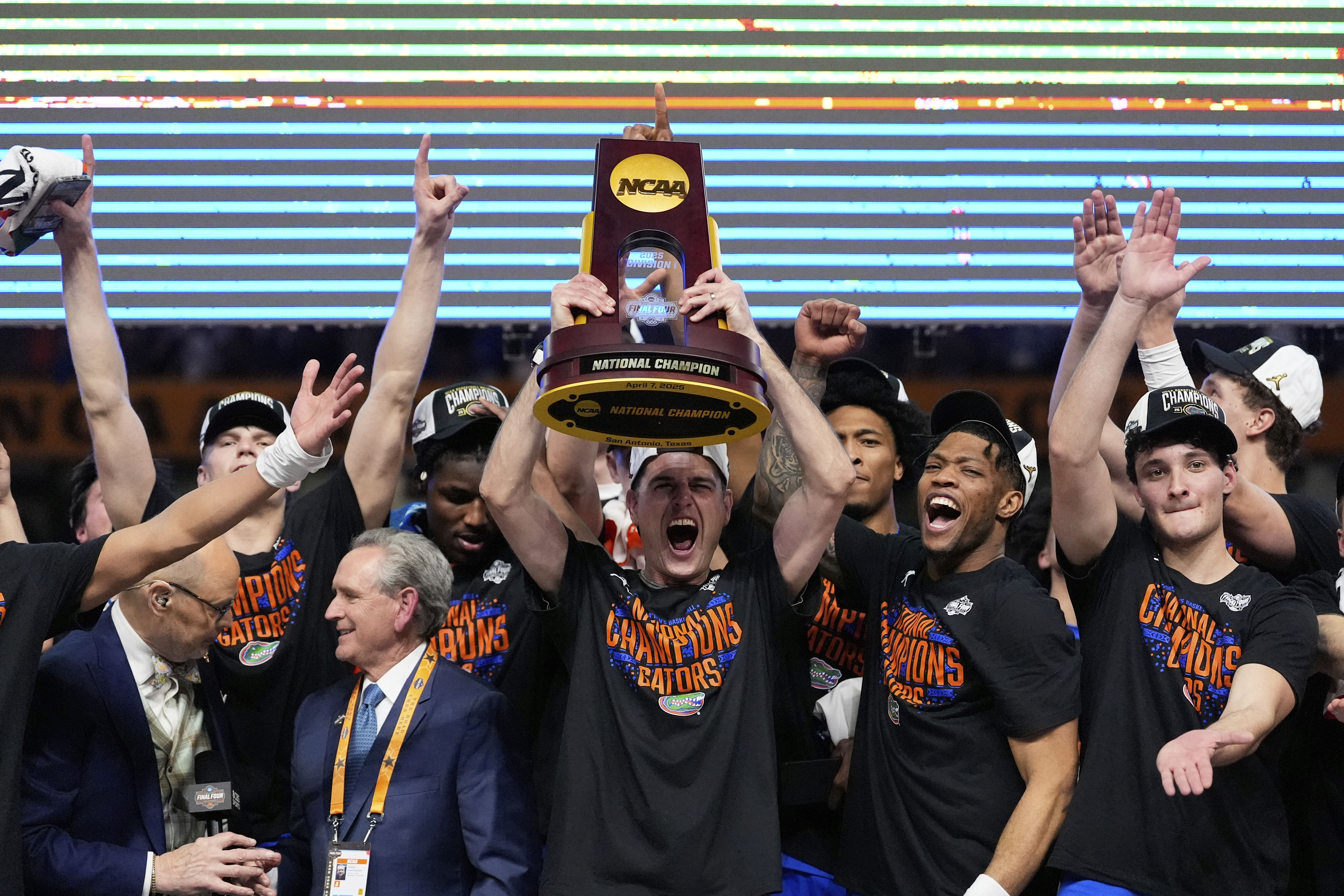 Florida celebrates with the trophy after their win against the Houston in the national championship at the Final Four of the NCAA college basketball tournament, Monday, April 7, 2025, in San Antonio. (AP Photo/Brynn Anderson)