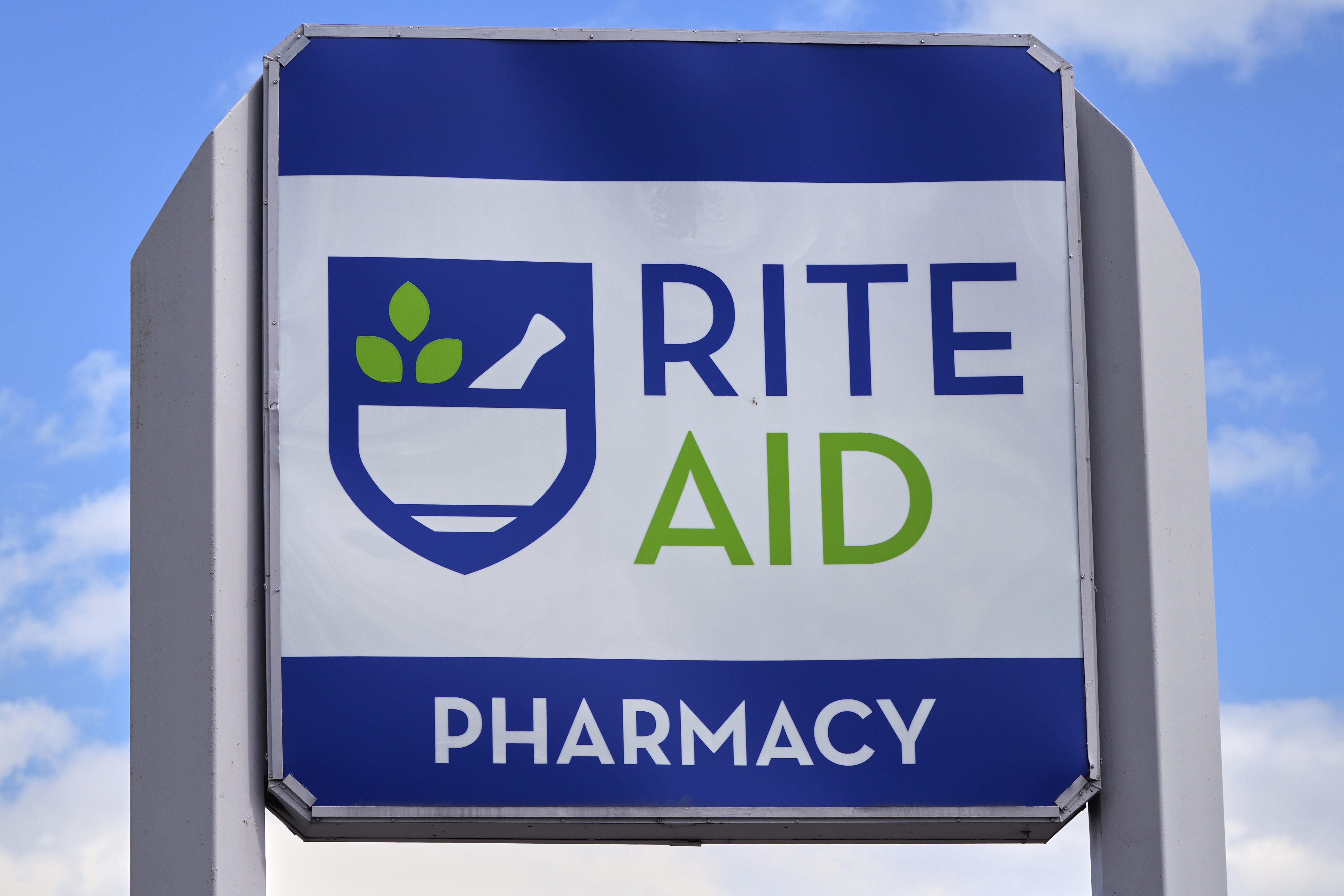 FILE - A sign with the company's logo stands outside a Rite Aid store in Salem, N.H., on Wednesday, May 29, 2024. (AP Photo/Charles Krupa, File)