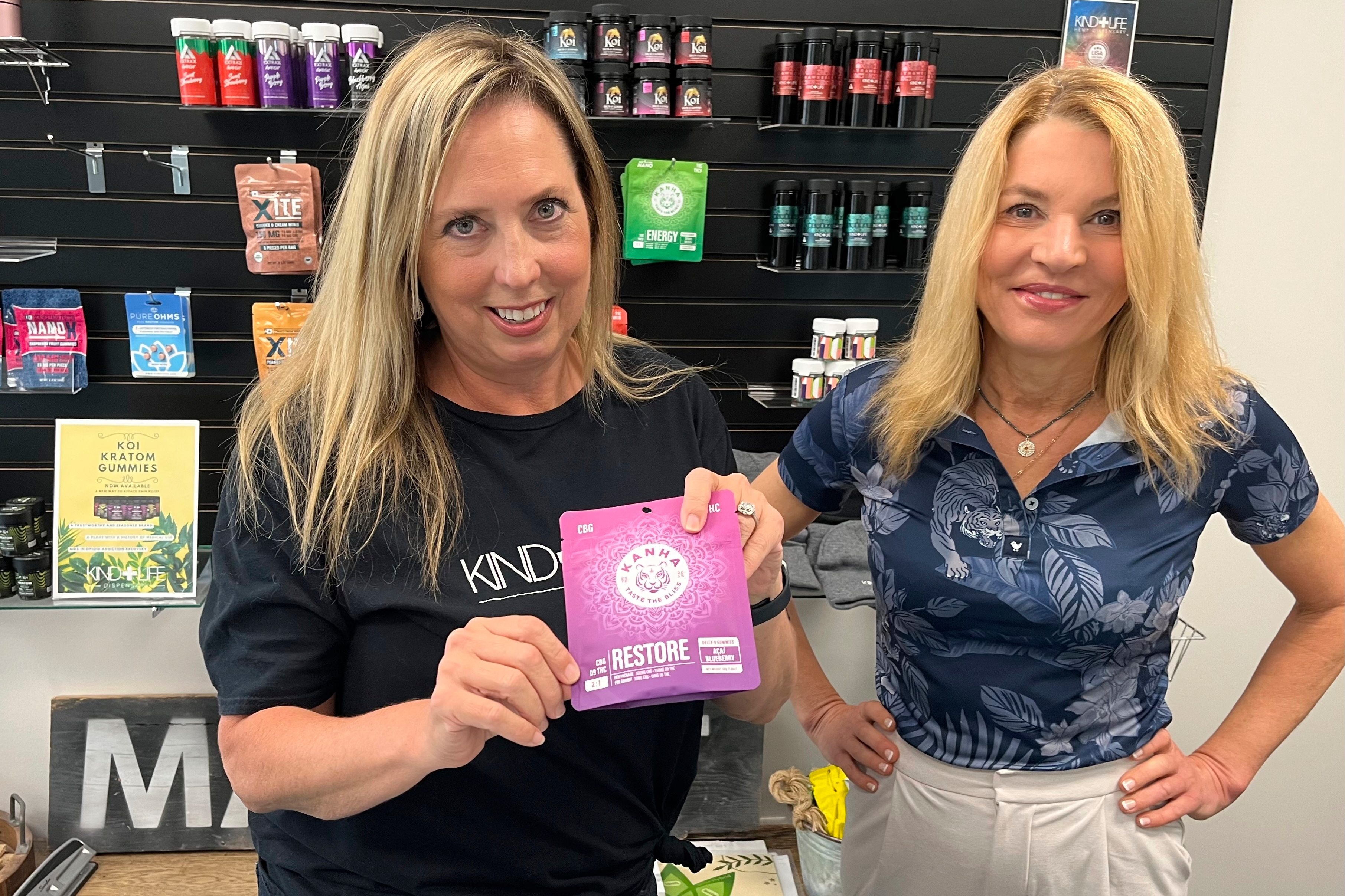 Andrea Watkins, left, and Dr. Andrea Holmes, right, co-owners of Kind Life Dispensary that sells an array of products containing hemp-based THC, poses for a photo in their shop in Lincoln, Neb., May 1, 2025. (AP Photo/Margery Beck)