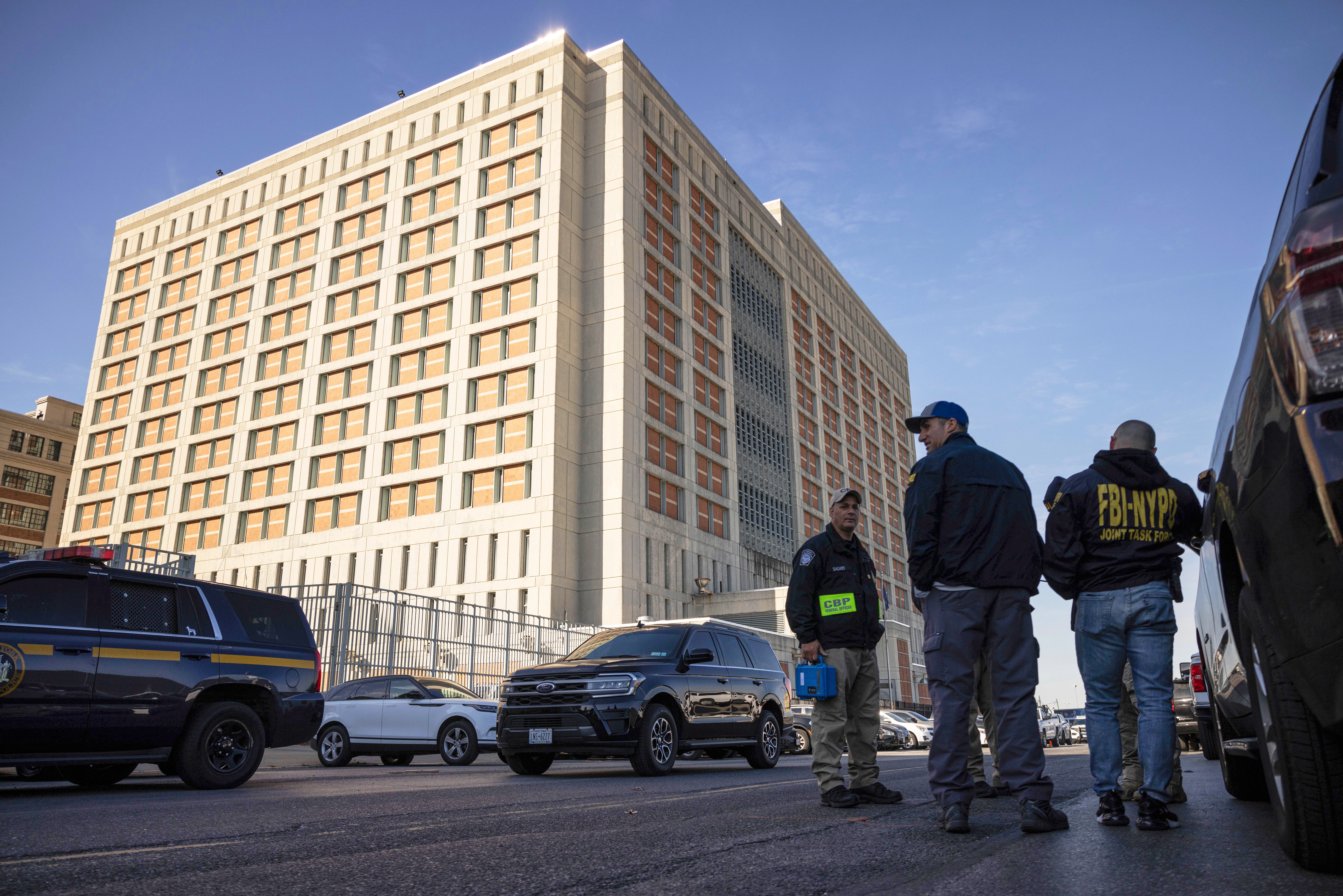 FILE - Federal enforcement officers stand outside the Metropolitan Detention Center, where Sean "Diddy" Combs is incarcerated on Oct. 28, 2024, in the Brooklyn Borough of New York. (AP Photo/Yuki Iwamura, File)