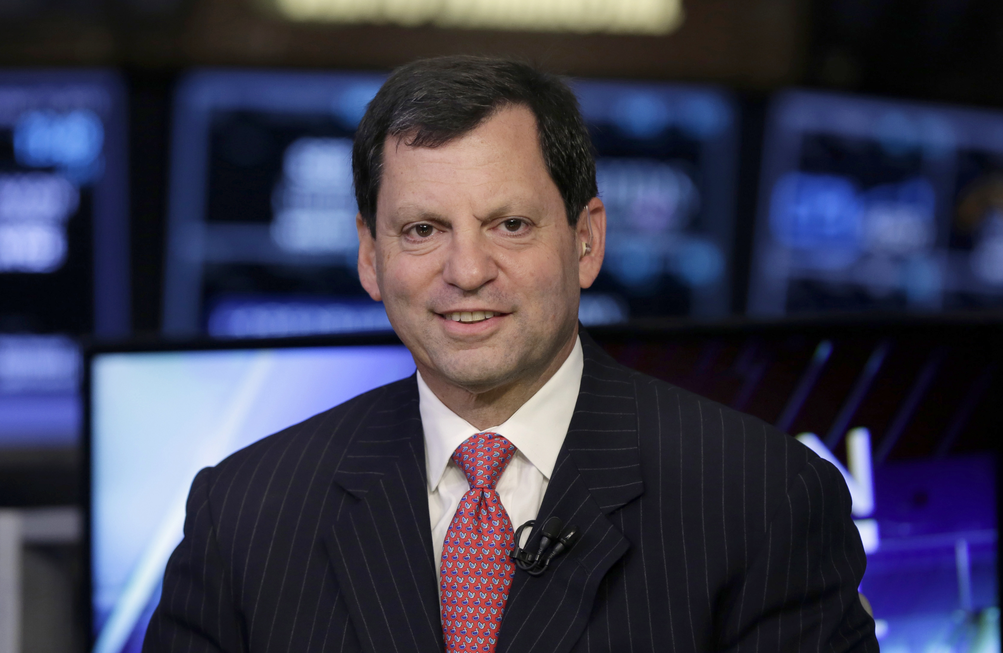 FILE- First Data Corp. Chairman & CEO Frank Bisignano is interviewed on the floor of the New York Stock Exchange, Oct. 15, 2015. (AP Photo/Richard Drew, File)