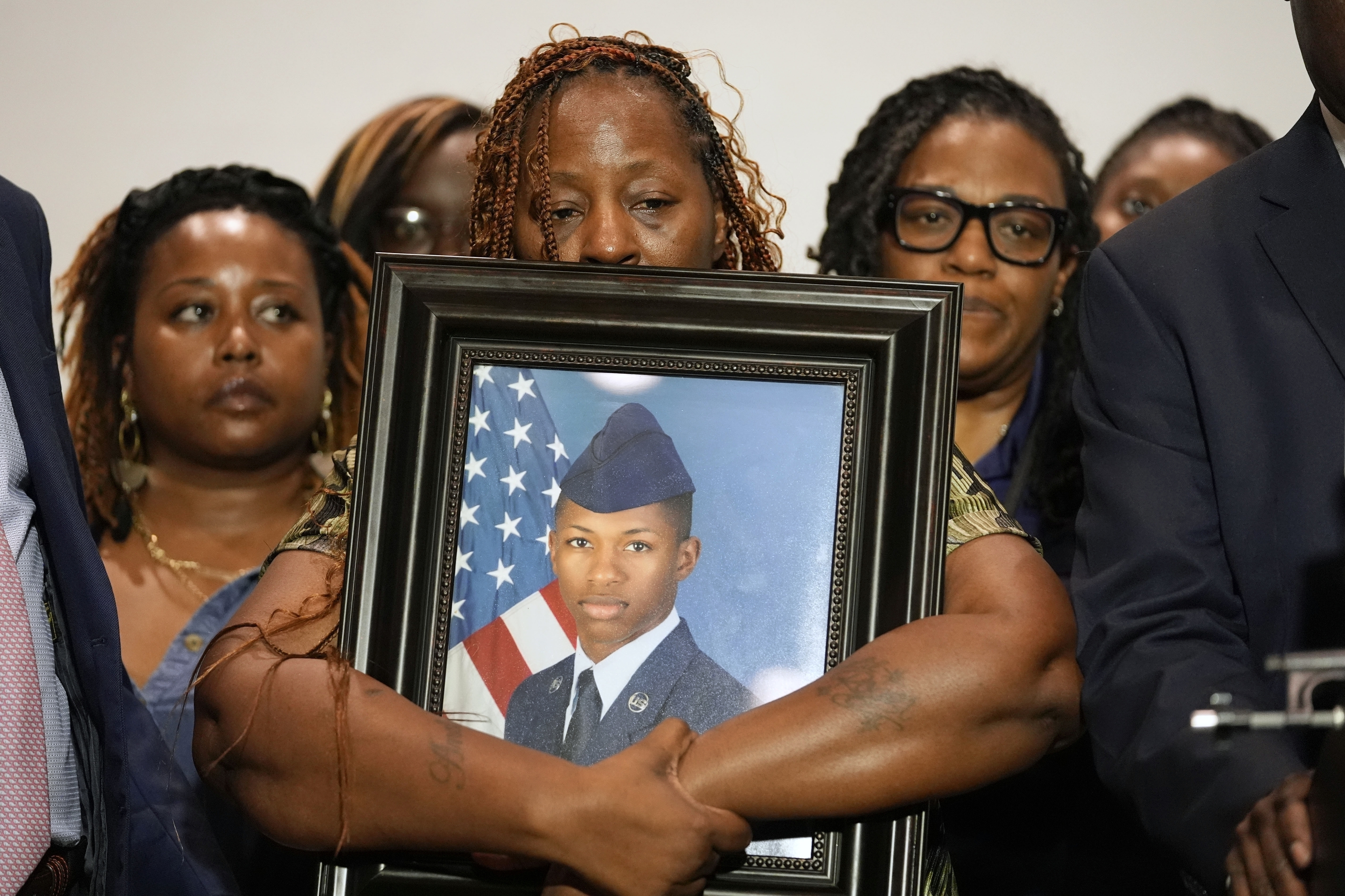 FILE - Chantemekki Fortson, mother of Roger Fortson, holds a photo of her son during a news conference, May 9, 2024, in Fort Walton Beach, Fla. (AP Photo/Gerald Herbert, File)