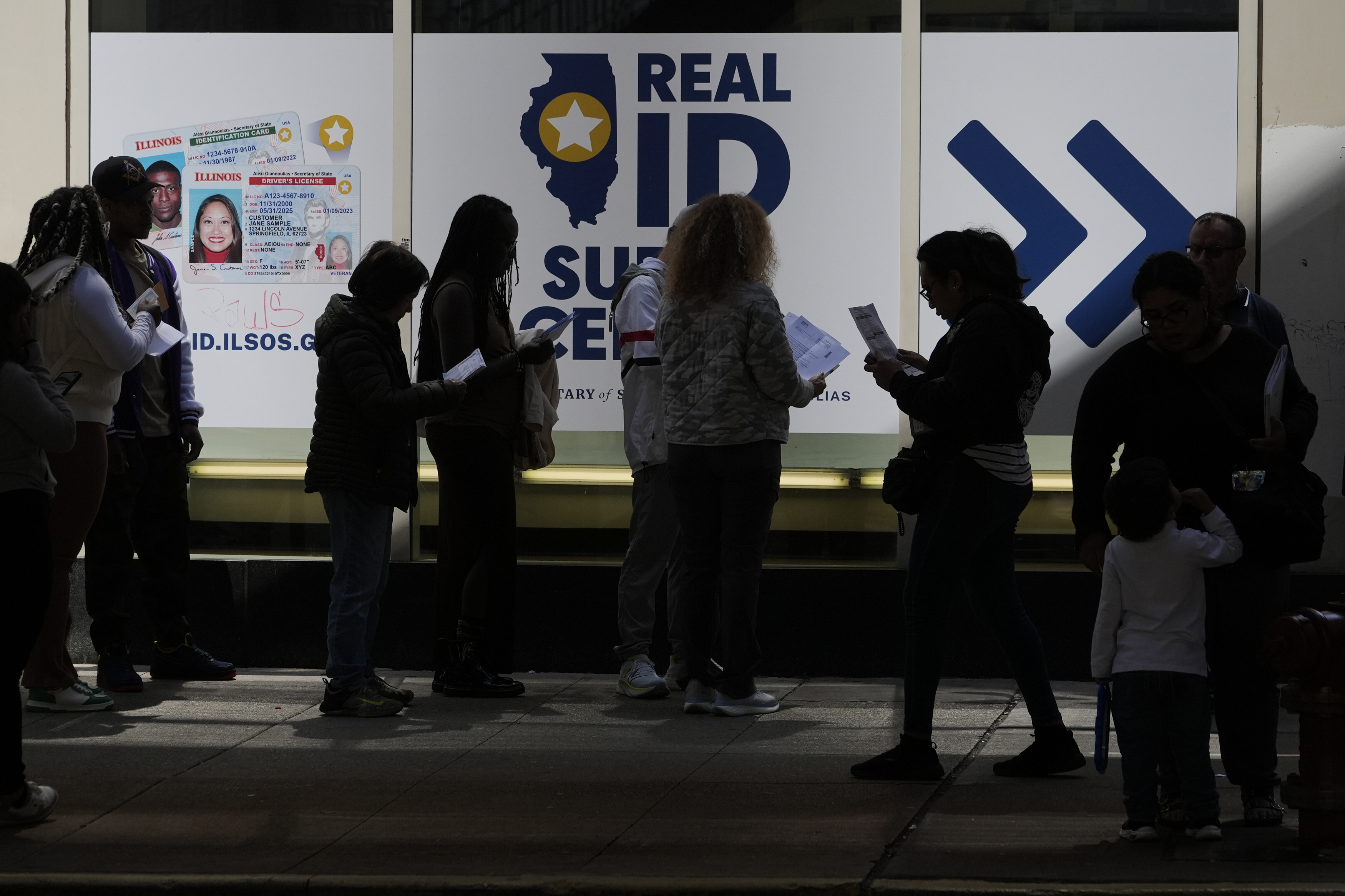 People line up to apply for Real ID at a Real ID Supercenter in downtown Chicago, Tuesday, May 6, 2025. (AP Photo/Kiichiro Sato)