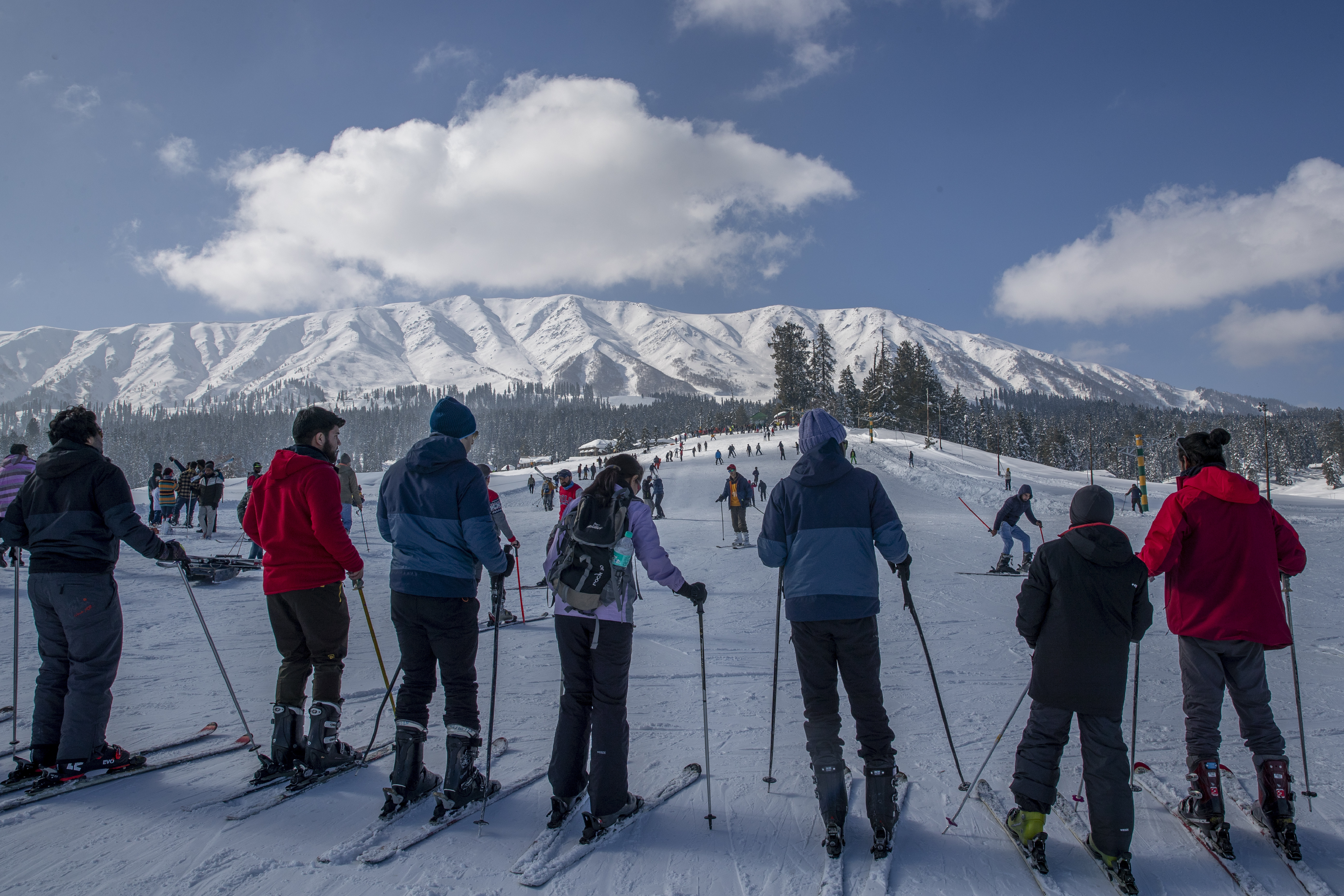 FILE - Tourists wait for their turn to use a ski-lift to transport them up a slope in Gulmarg, northwest of Srinagar, Indian controlled Kashmir, Jan. 10, 2021. (AP Photo/Dar Yasin, File)