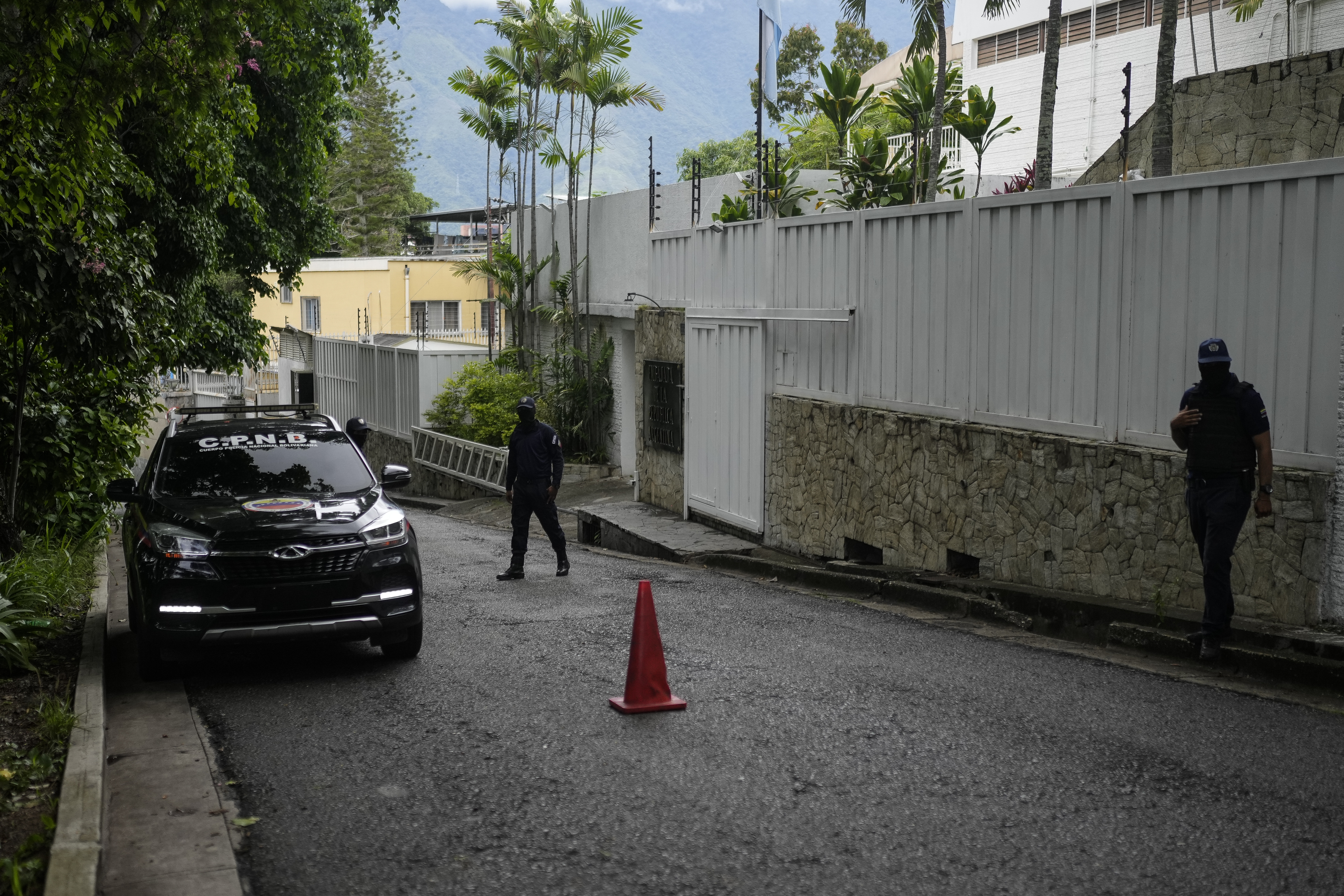 FILE - A police patrol car sits parked outside Argentina's embassy where some members of Venezuela's opposition are seeking asylum inside, in Caracas, Venezuela, July 31, 2024, three days after the contested presidential election. (AP Photo/Matias Delacroix, File)