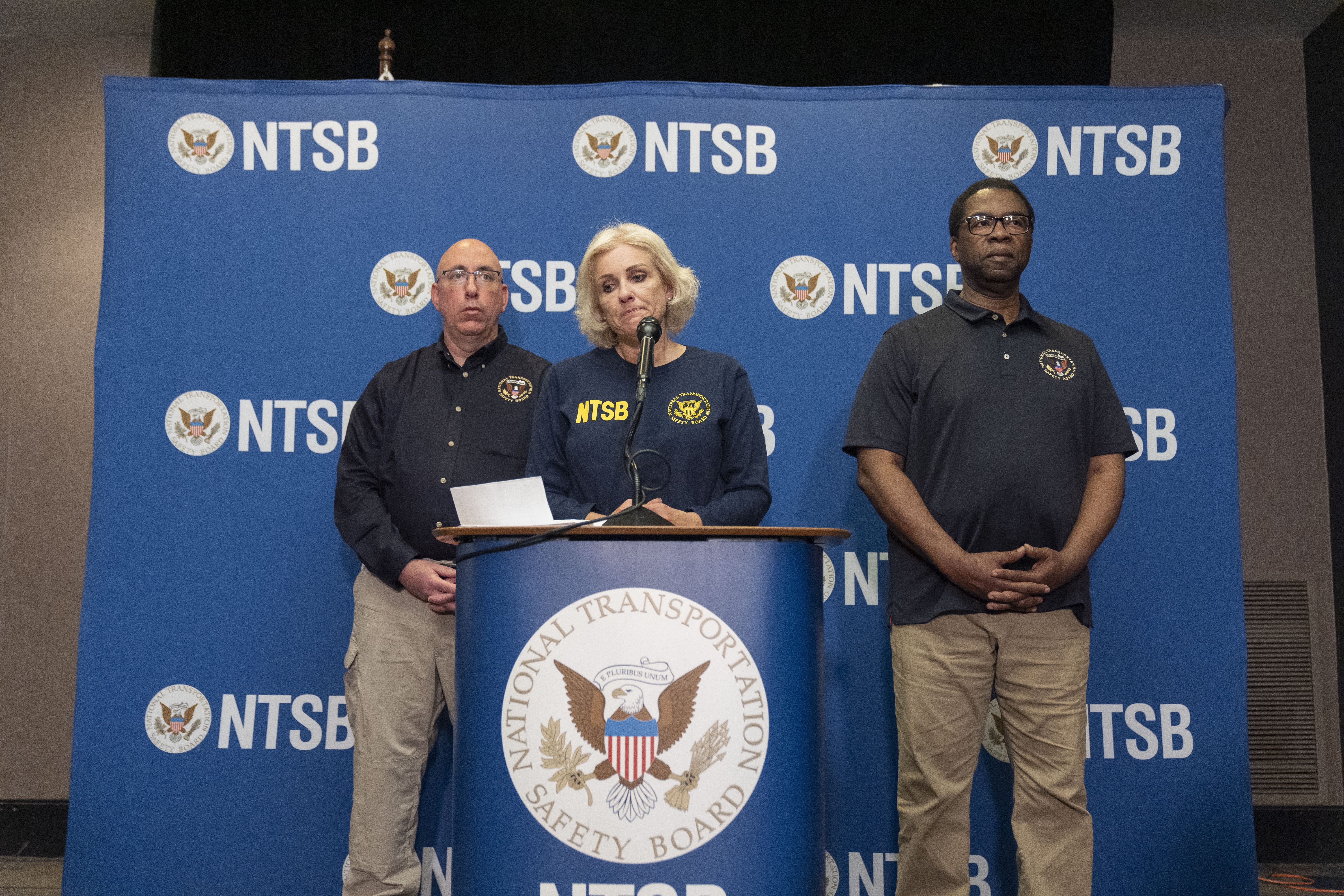 FILE - National Transportation Safety Board Chair Jennifer Homendy, center, pauses while speaking accompanied by NTSB Investigator in Charge, Marcel Muise, left, and NTSB board member Alvin Brown, during a news conference, March 27, 2024, in Linthicum Heights, Md. (AP Photo/Alex Brandon, File)