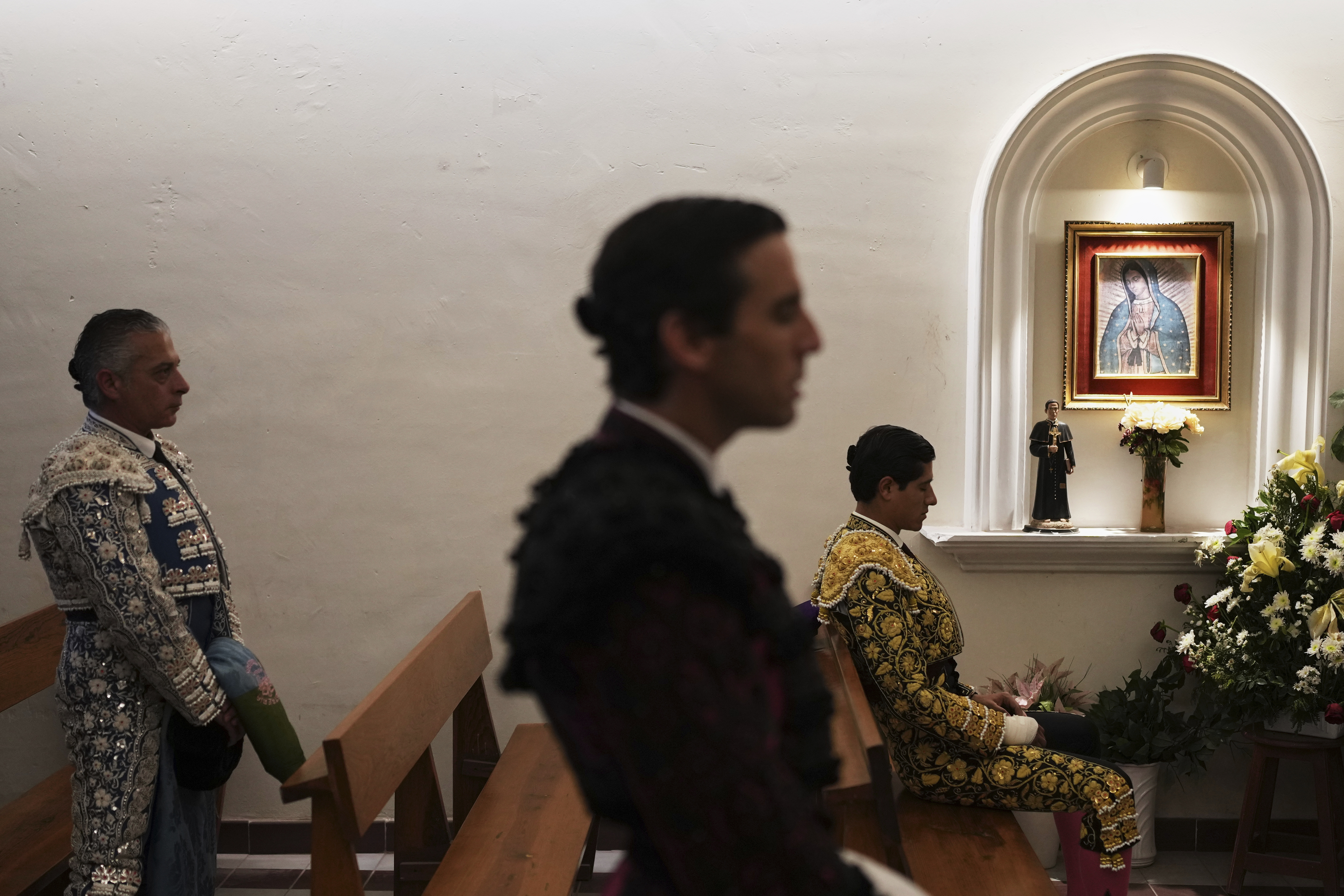 Bullfighters pray in the bullring chapel before a bullfight in Aguascalientes, Mexico, Saturday, April 26, 2025. (AP Photo/Eduardo Verdugo)