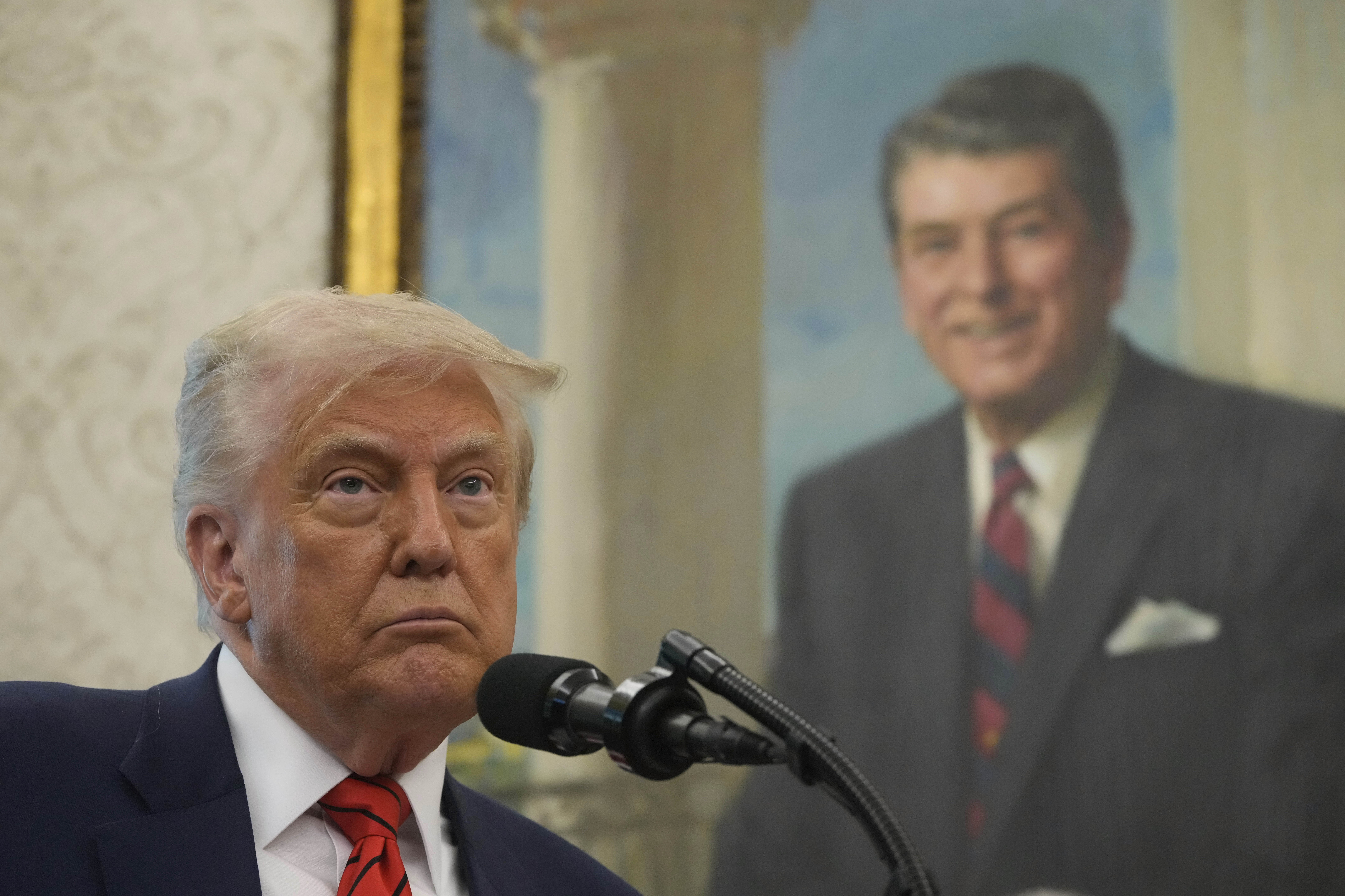 President Donald Trump speaks before Steve Witkoff is sworn as special envoy during a ceremony in the Oval Office of the White House, Tuesday, May 6, 2025, in Washington, with a portrait of former President Ronald Reagan in the background. (AP Photo/Mark Schiefelbein)